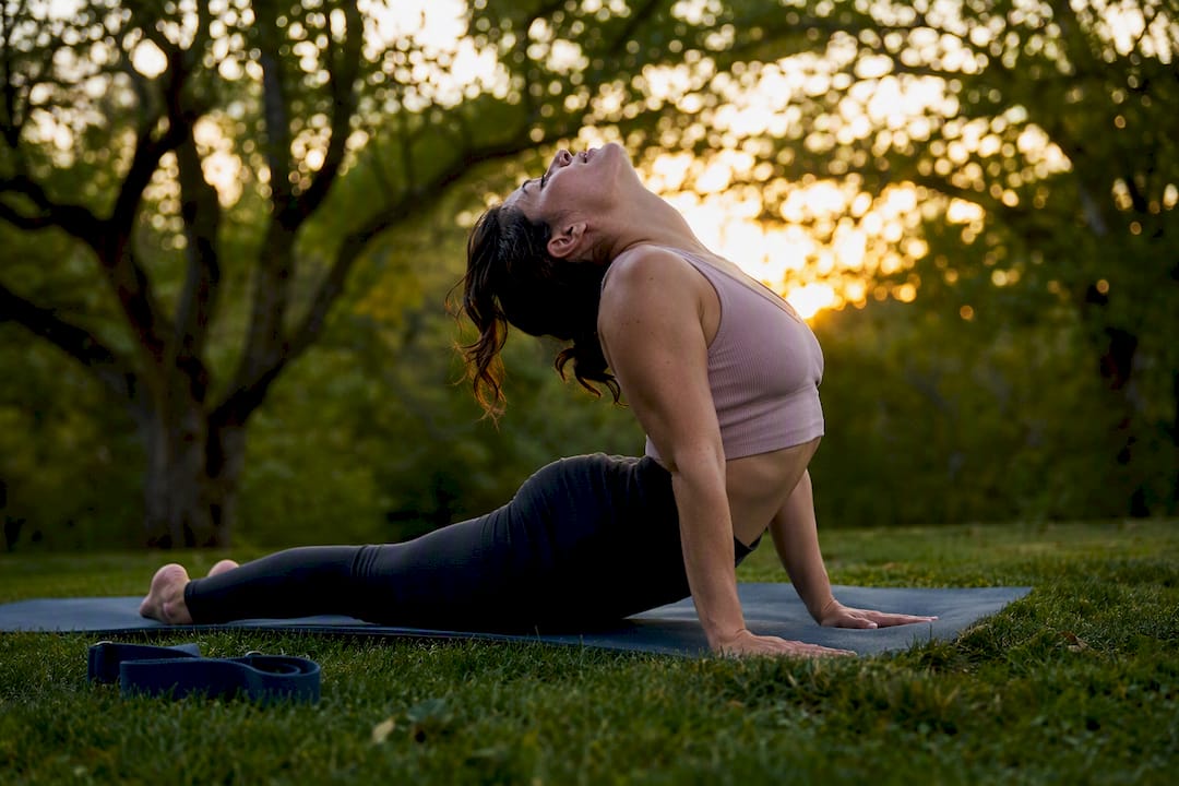 Person doing gentle backbend stretch indoors