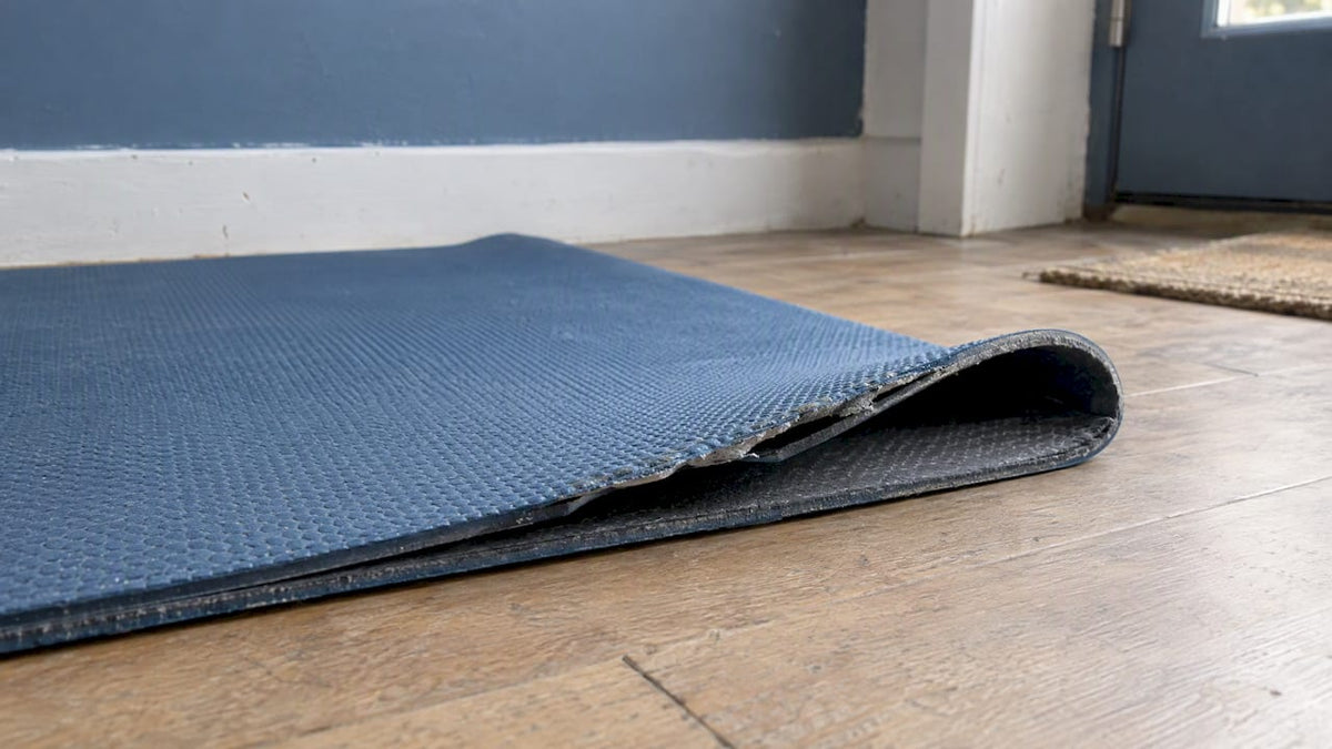 Yoga mat top layer lifting from its base