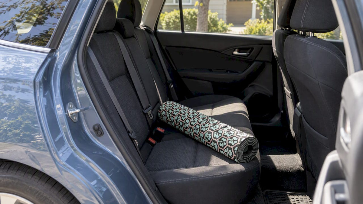 Yoga mat on a parked car's rear seat