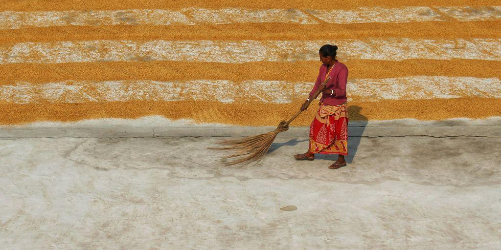 a man holding a broom