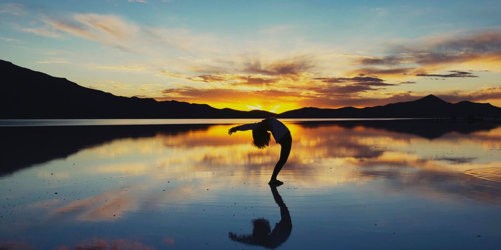 silhouette photography of woman doing yoga