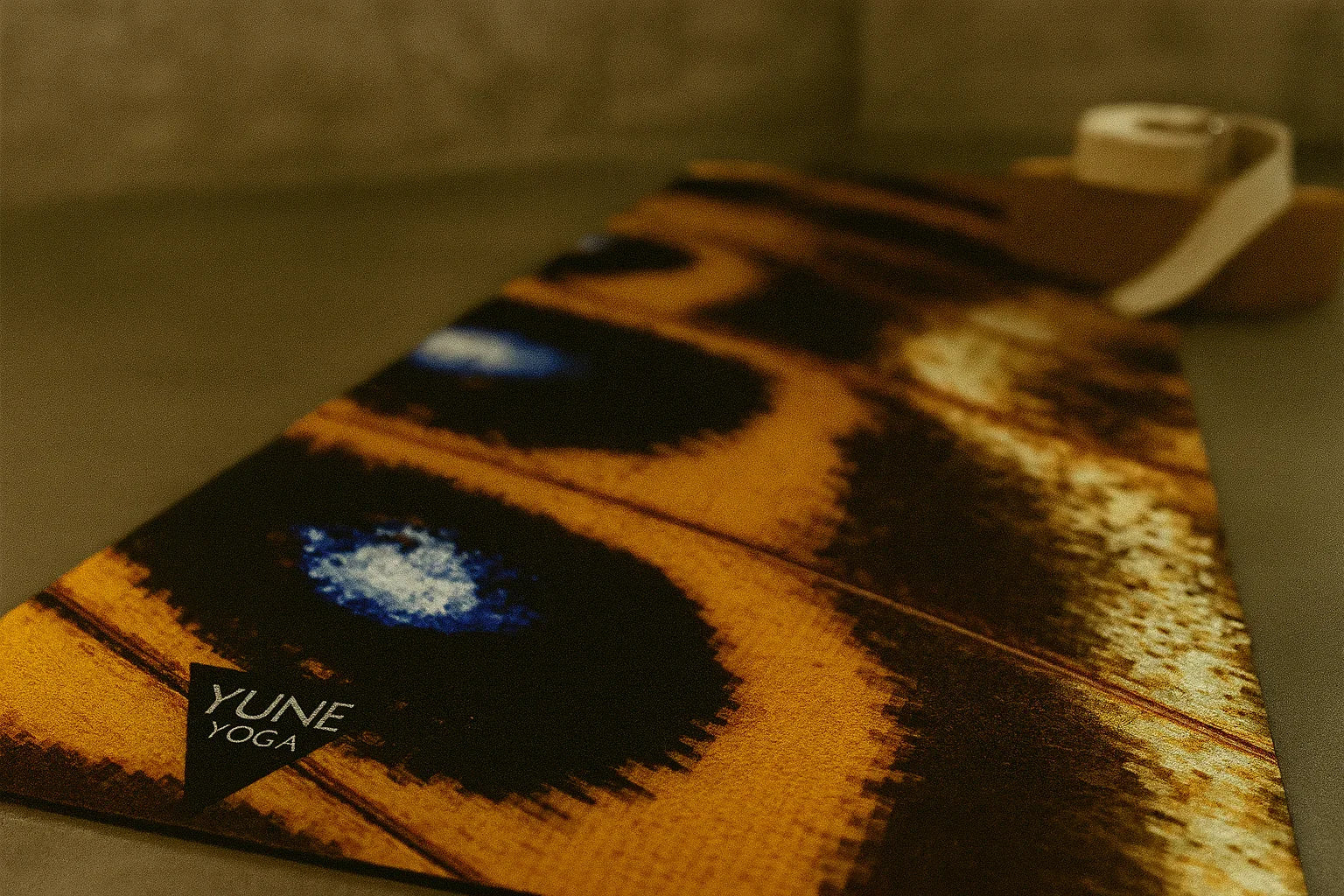 Yume Yoga mat with brand logo on a neutral background