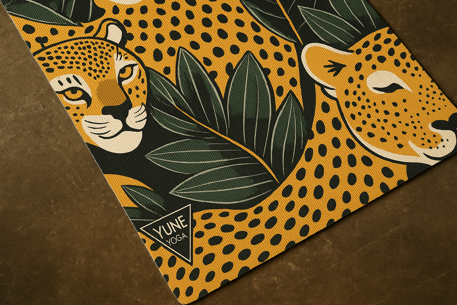 Yume Yoga mat with leopard design and brand logo on a brown background