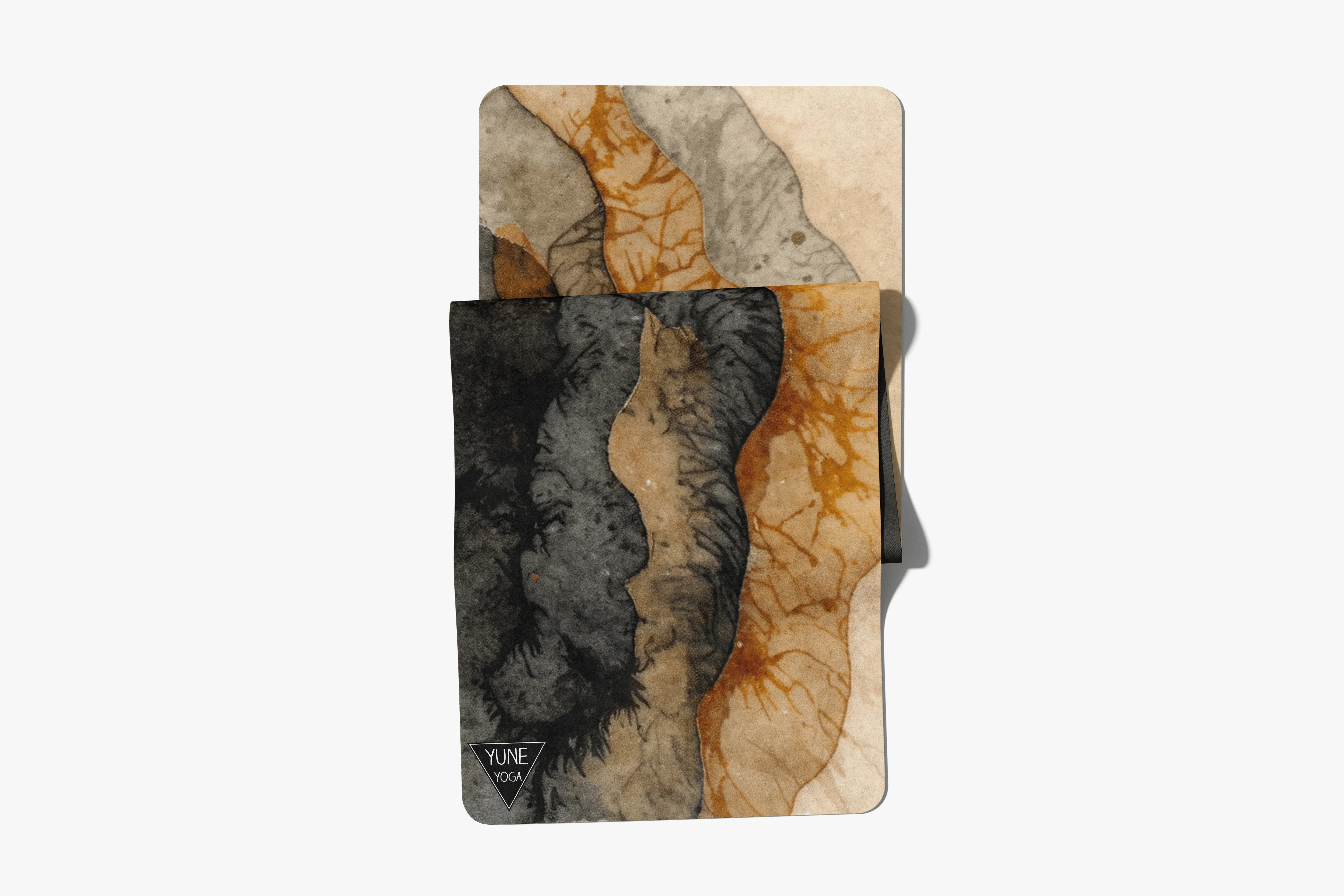 Abstract art yoga mat and matching towel set with earthy beige, black, and orange tones