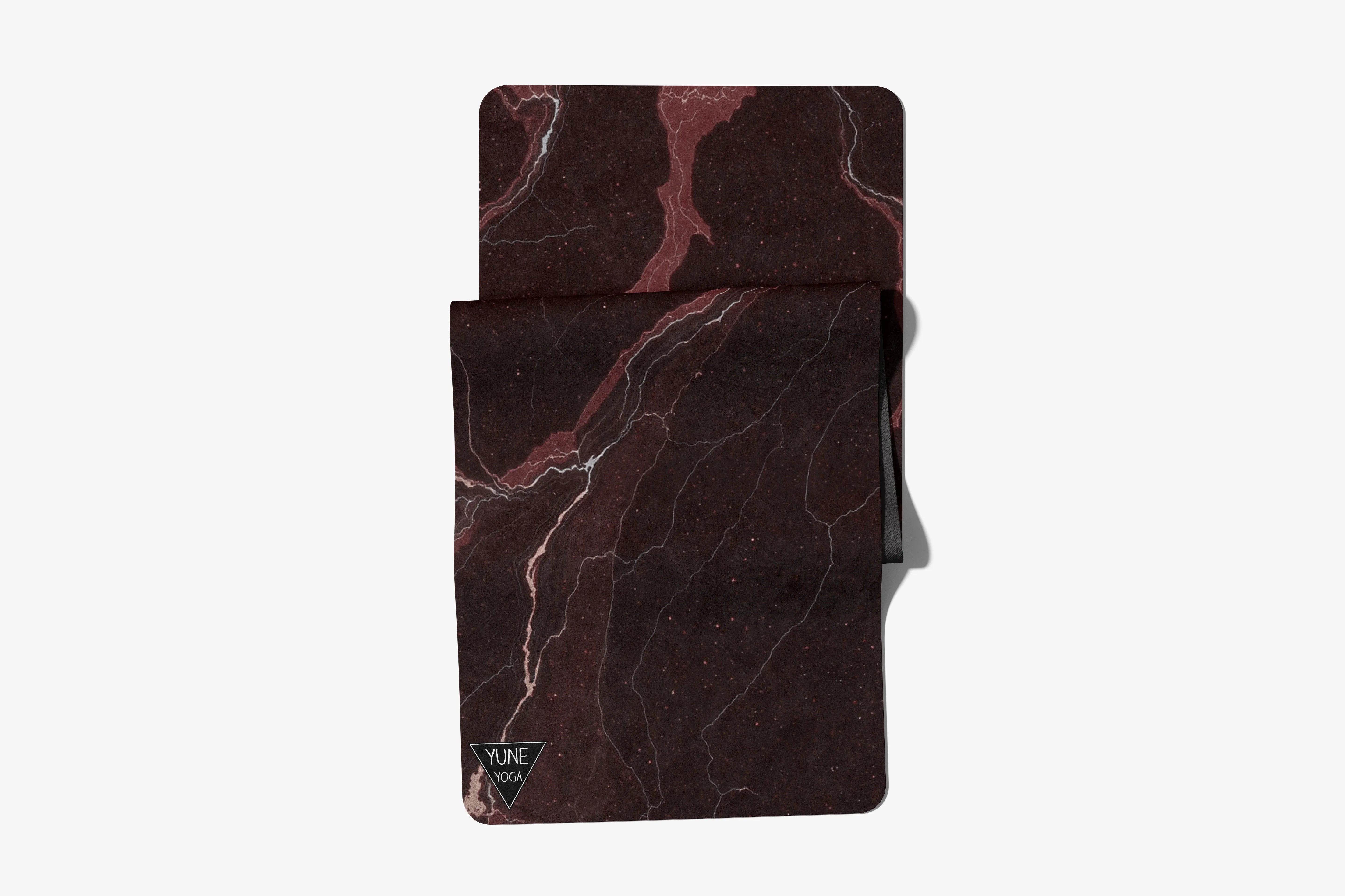 Marble pattern yoga mat and towel set in dark red and black, Yune Yoga logo visible