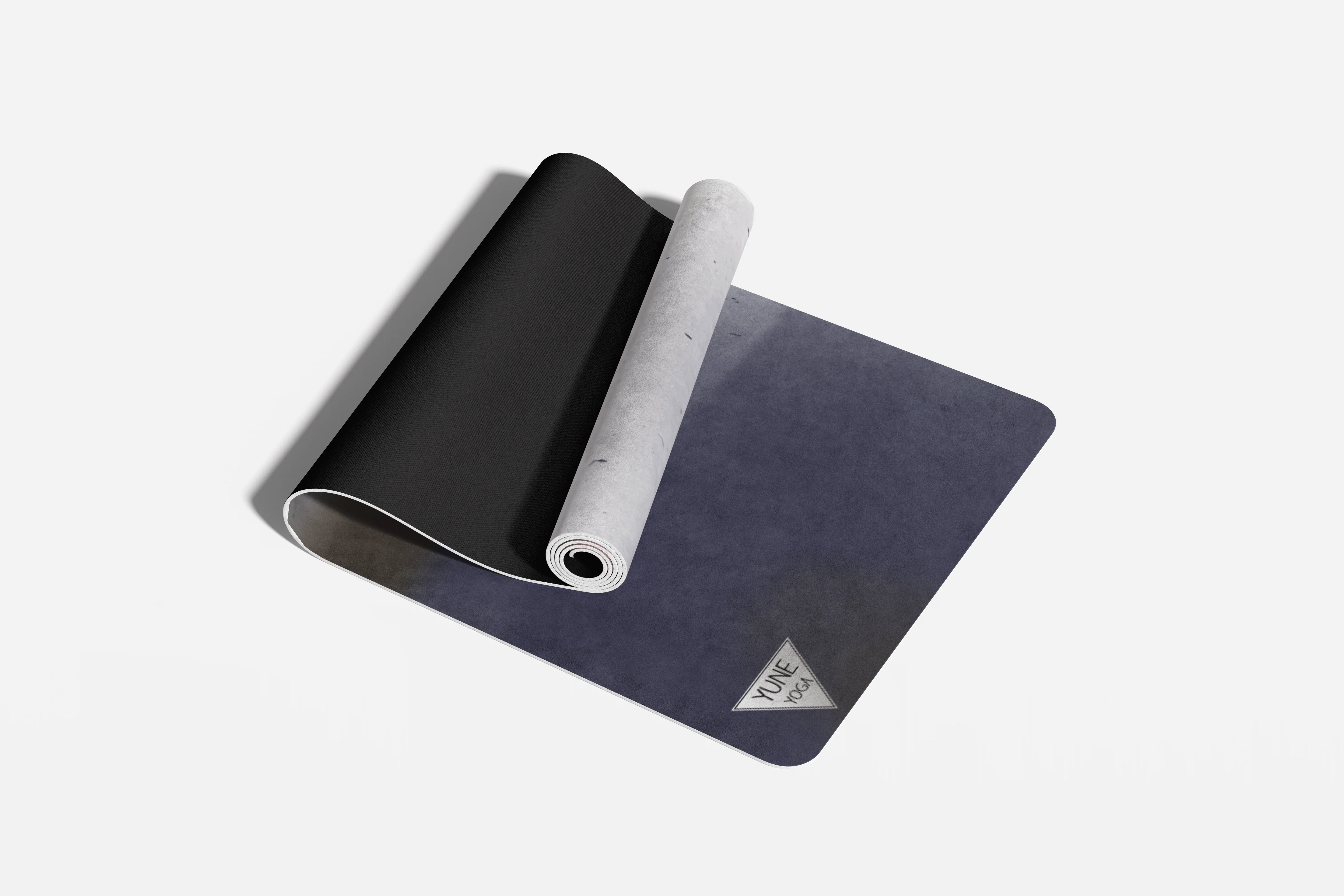 Black and blue yoga mat with a brand logo on a white background