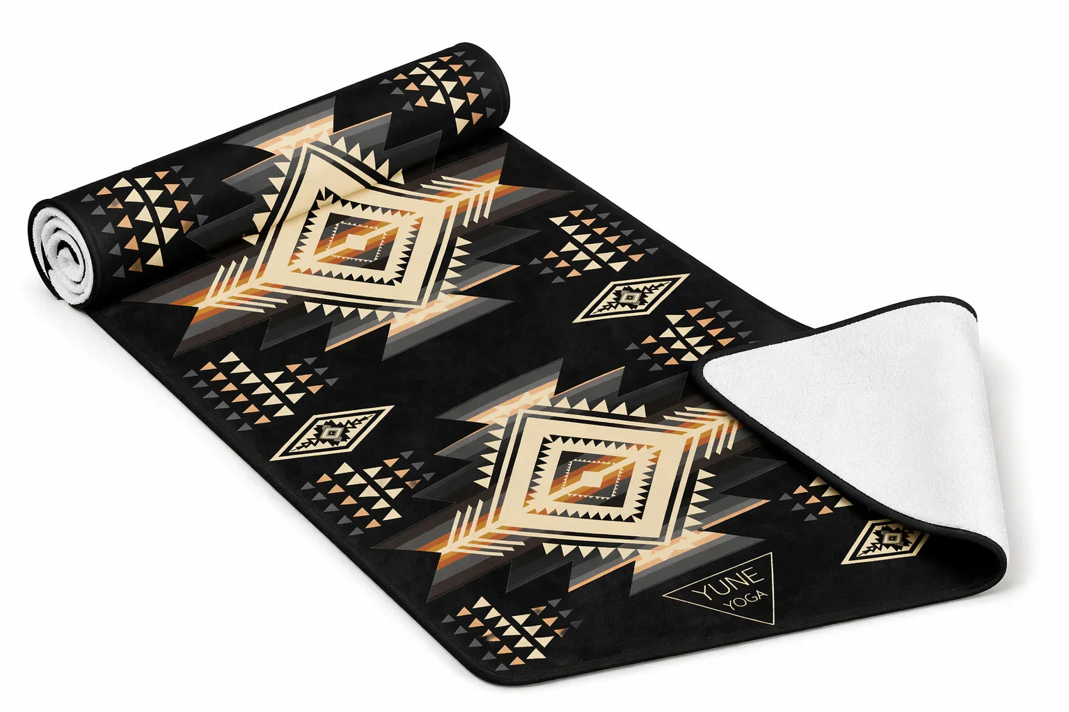 Black yoga towel with geometric Southwestern patterns in tan, orange, and white, flat lay view
