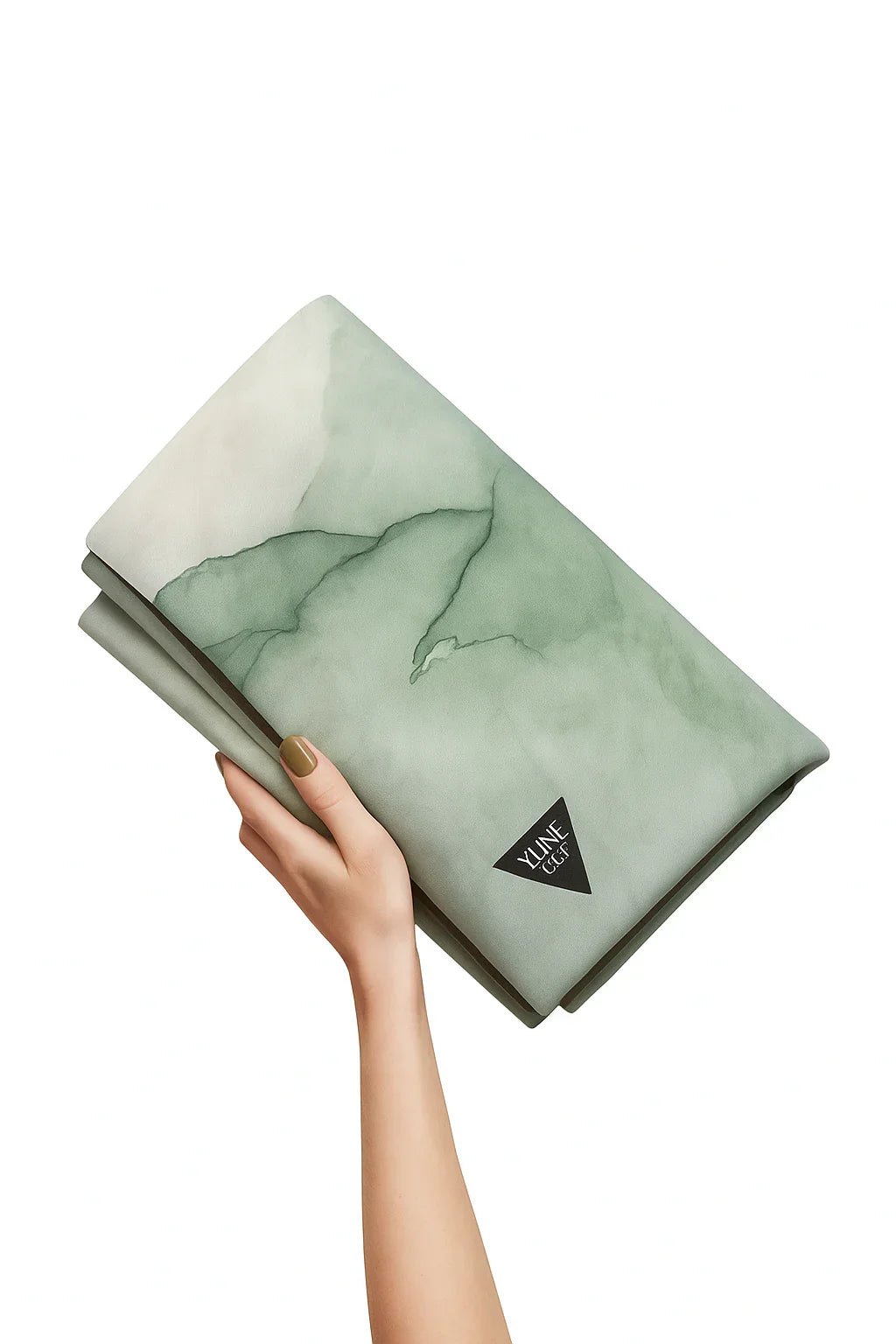 Hand holding a green marble-patterned notebook with a visible brand logo on a white background
