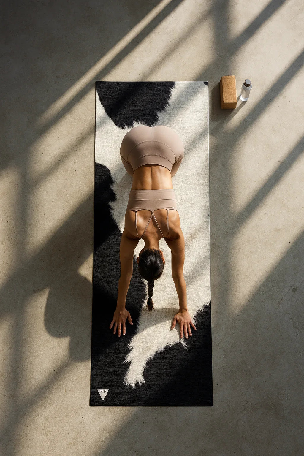 Person doing a handstand on a yoga mat with a minimal background