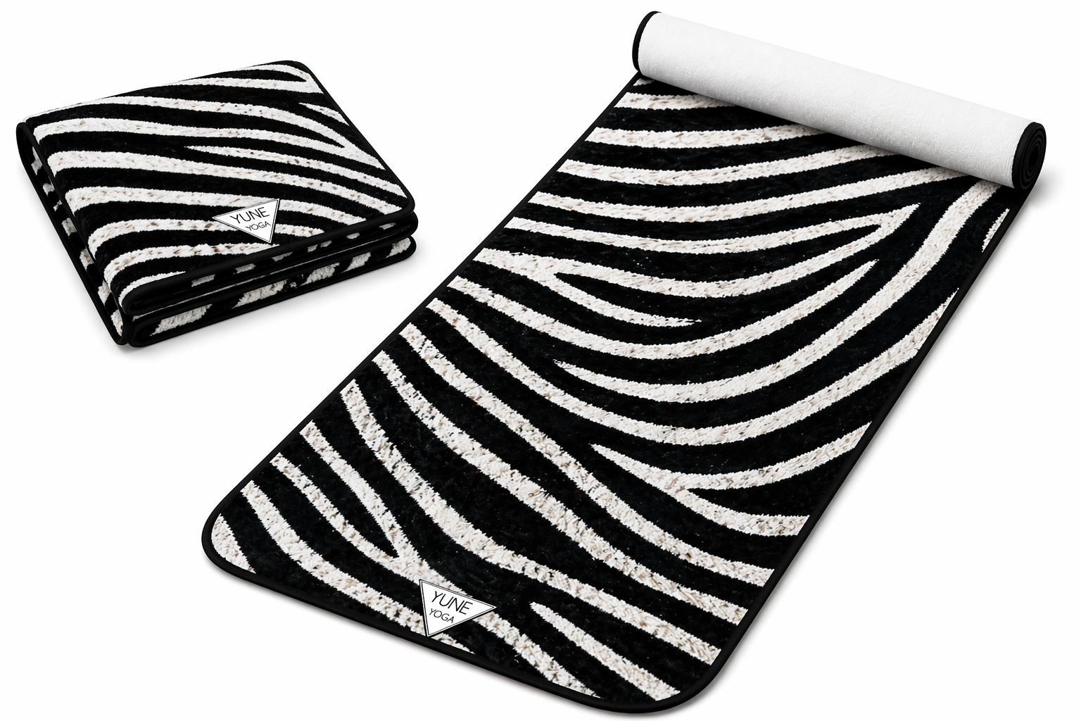 Black and white striped towel and mat on a white background
