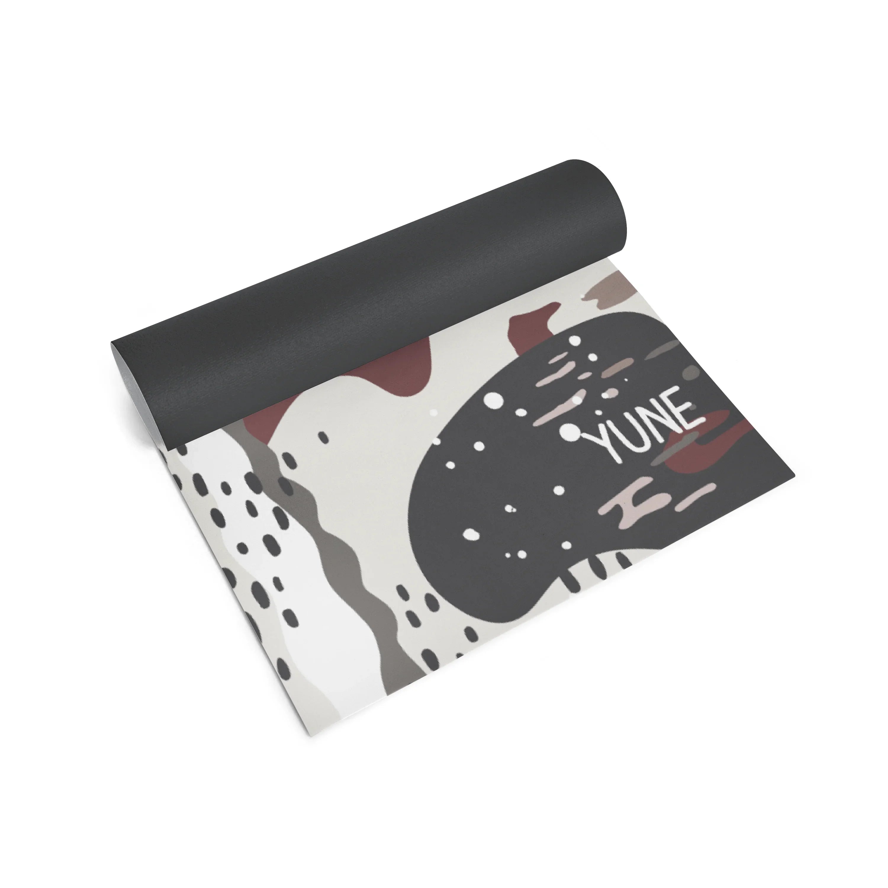 Yoga mat with abstract design and 'YUNE' branding on a white background