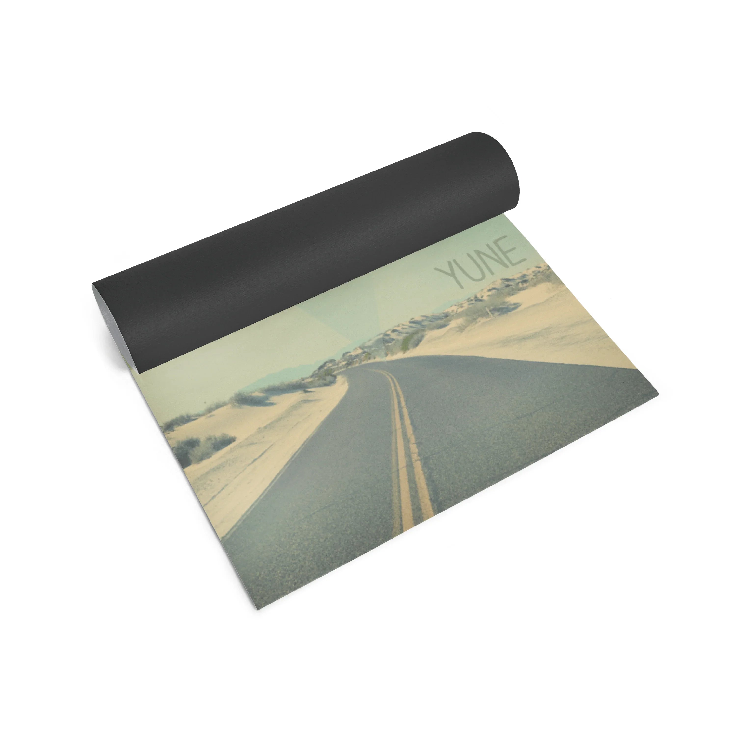 Yoga mat with a scenic design and 'Yune' branding on a white background