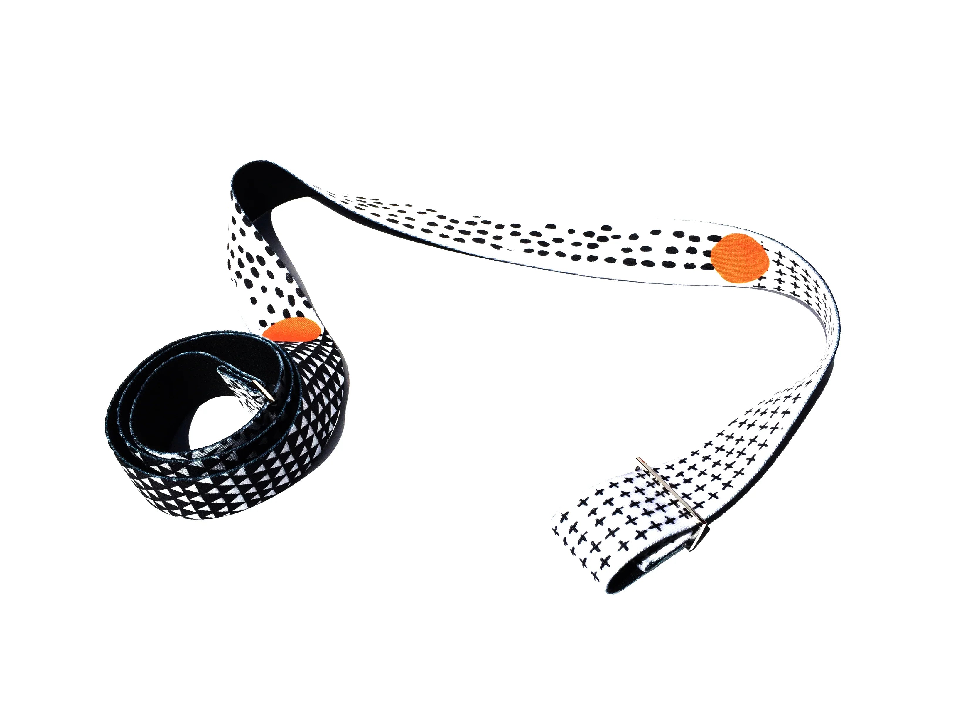 Black and white headband with orange accents on a white background