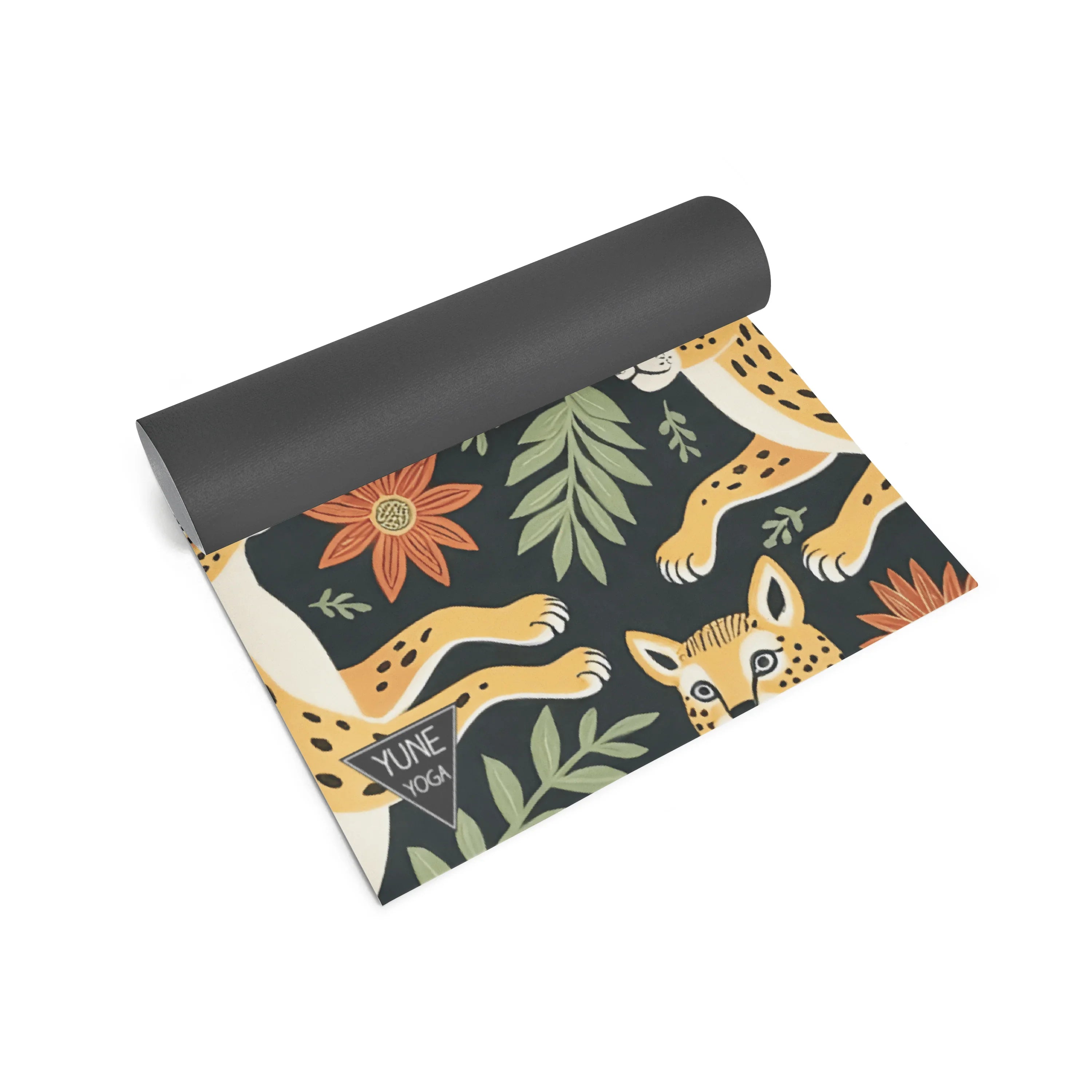 Yoga mat with animal and plant design on a white background