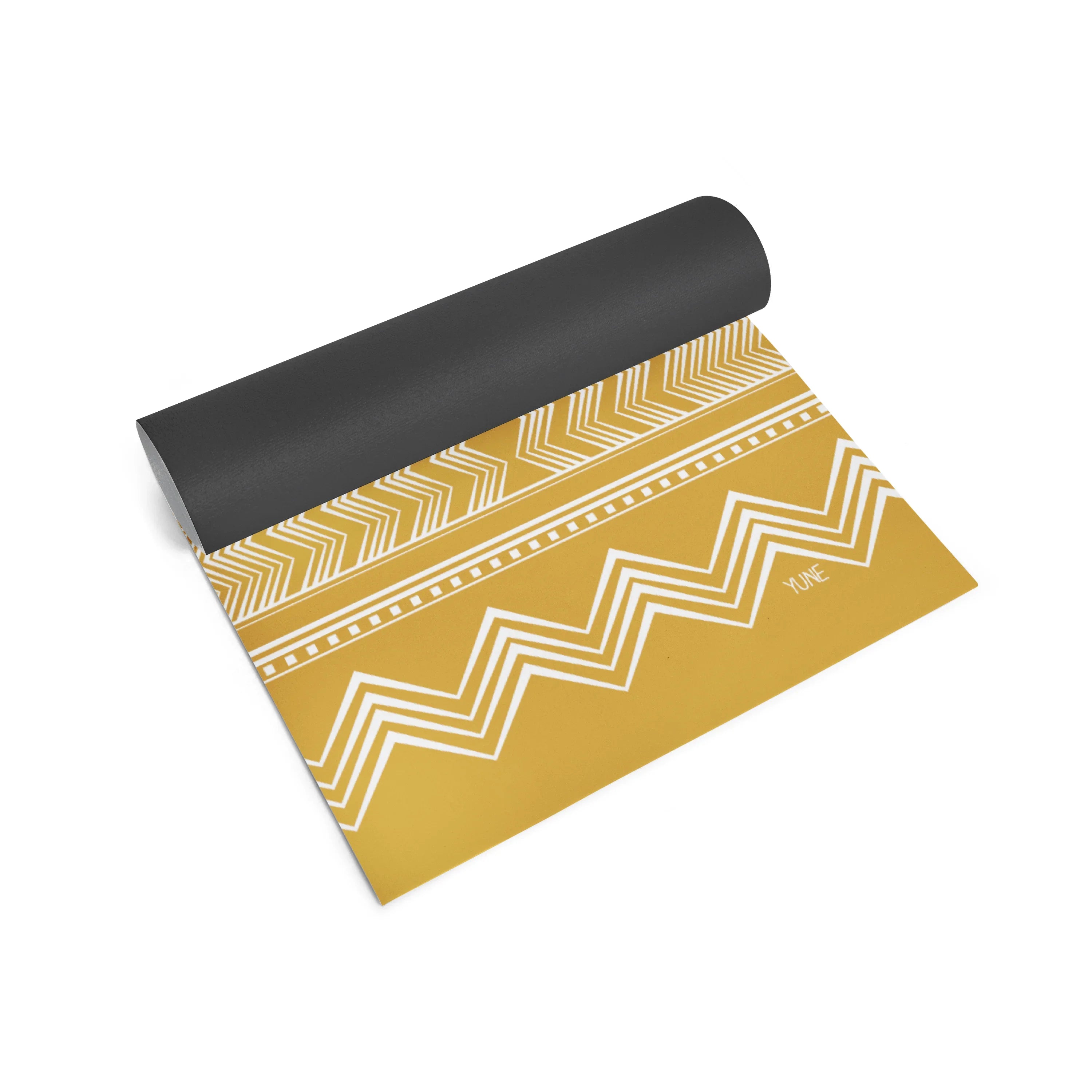 Yoga mat with black top and yellow pattern on a white background