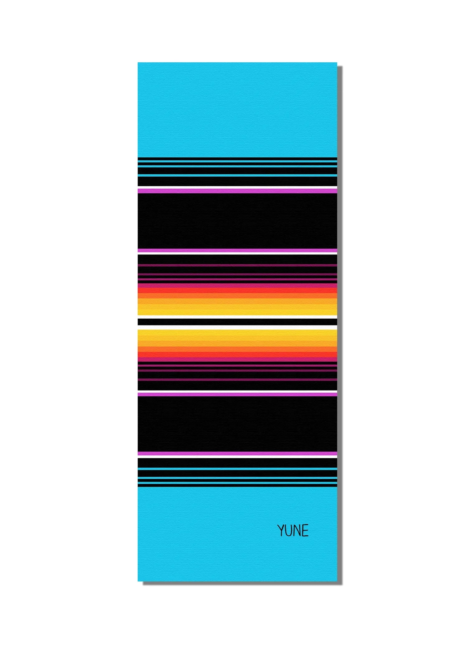 Yoga mat with colorful striped design on a white background