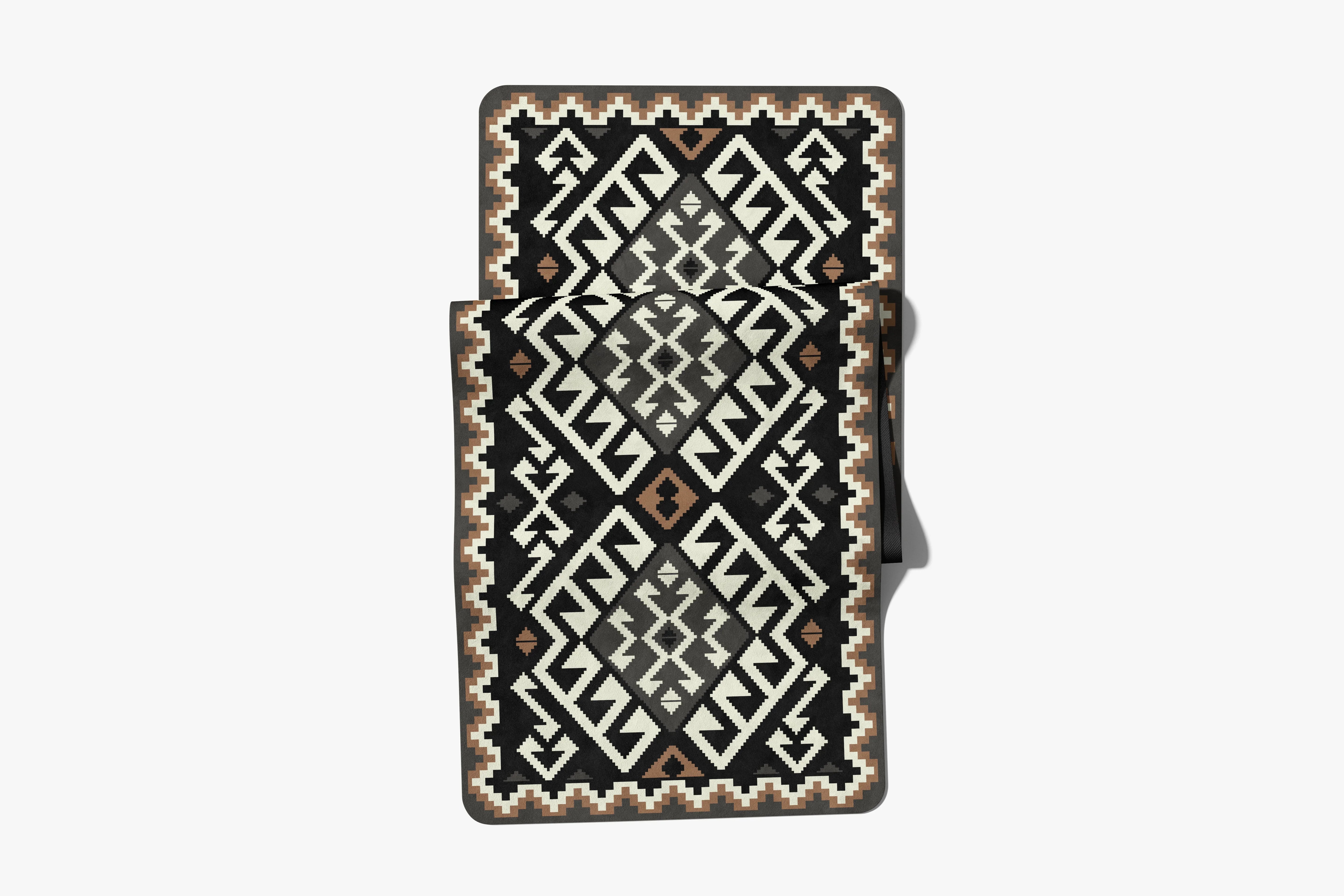 Decorative rug with geometric pattern on a white background