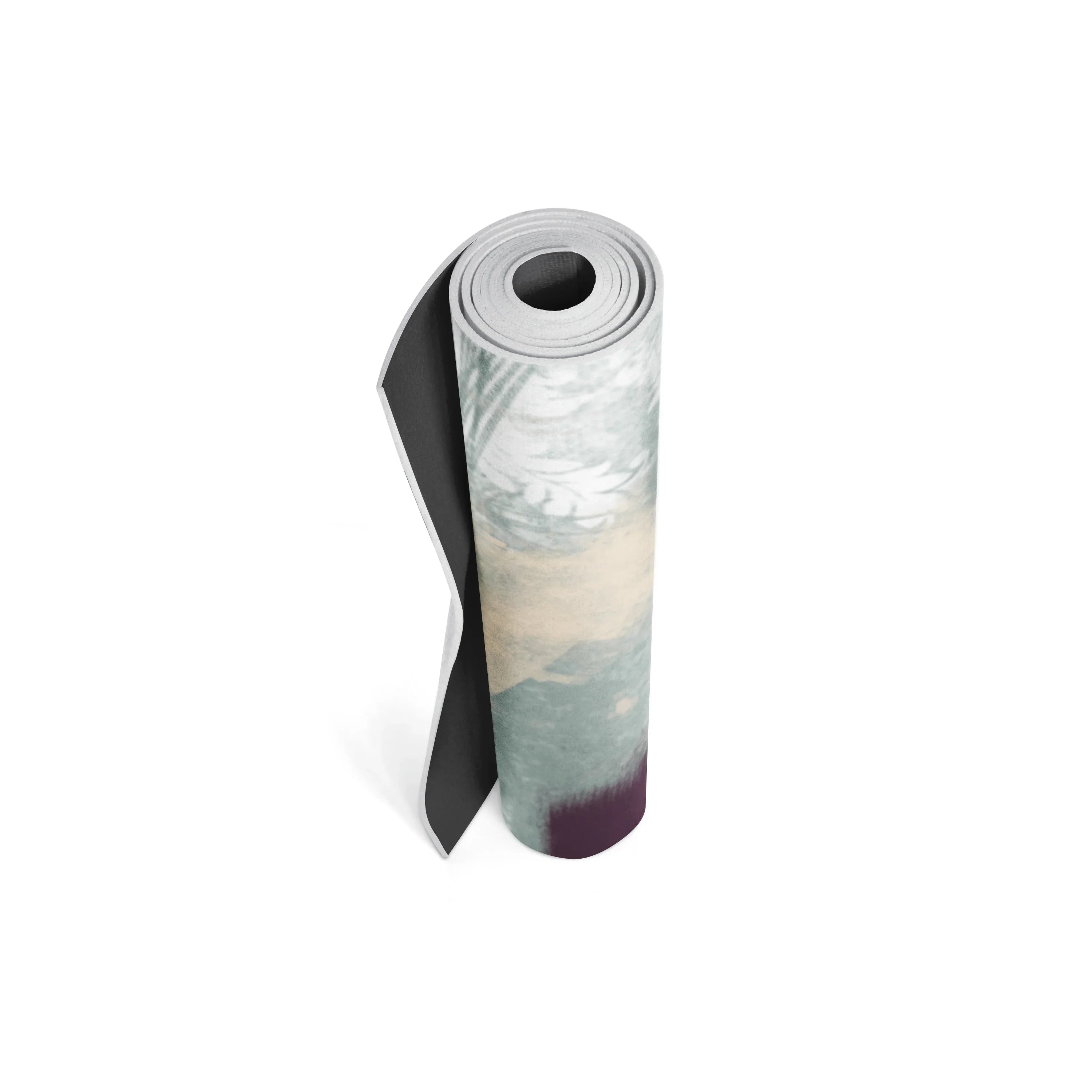 Rolled-up yoga mat with a scenic design on a white background