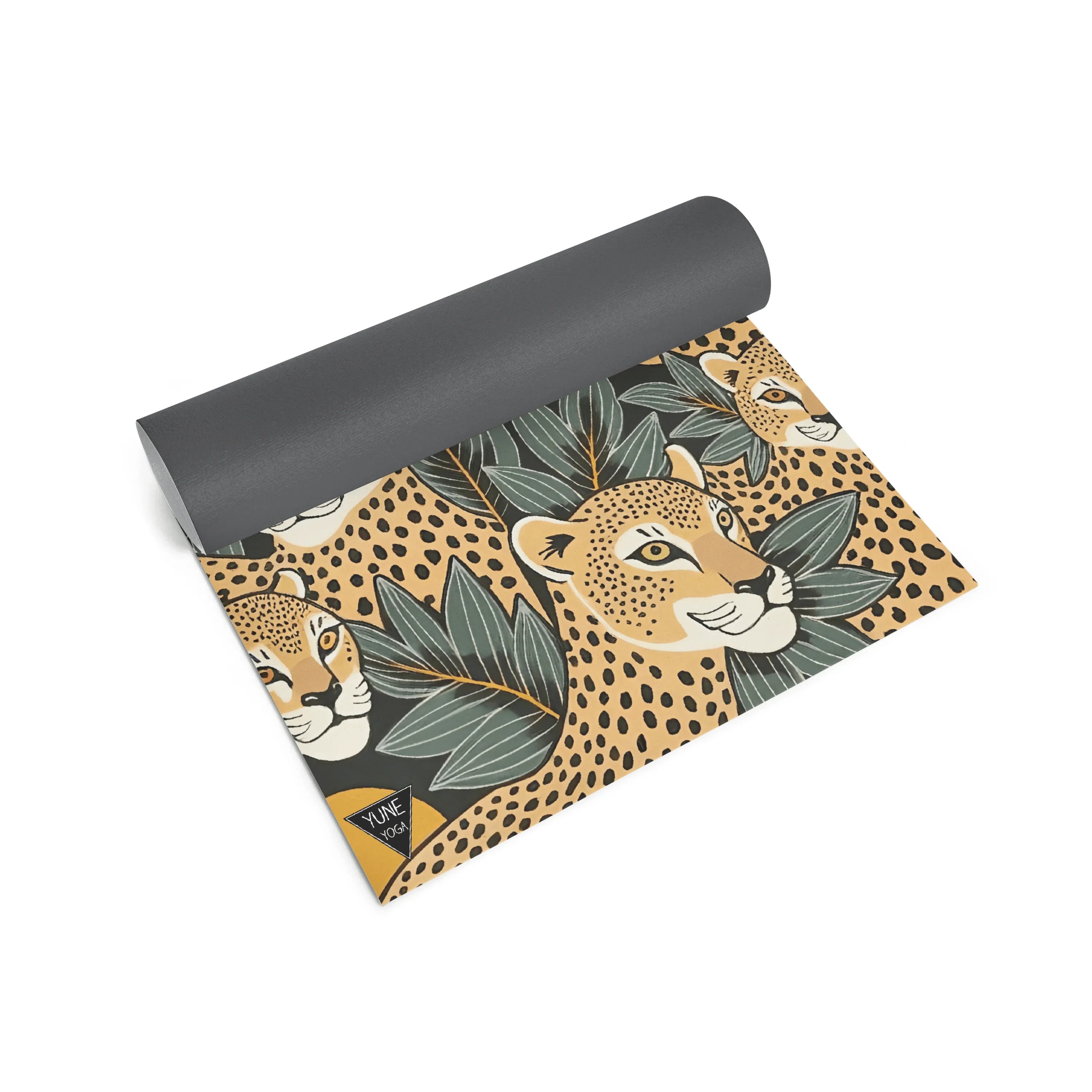 Yoga mat with leopard and leaf pattern on a white background