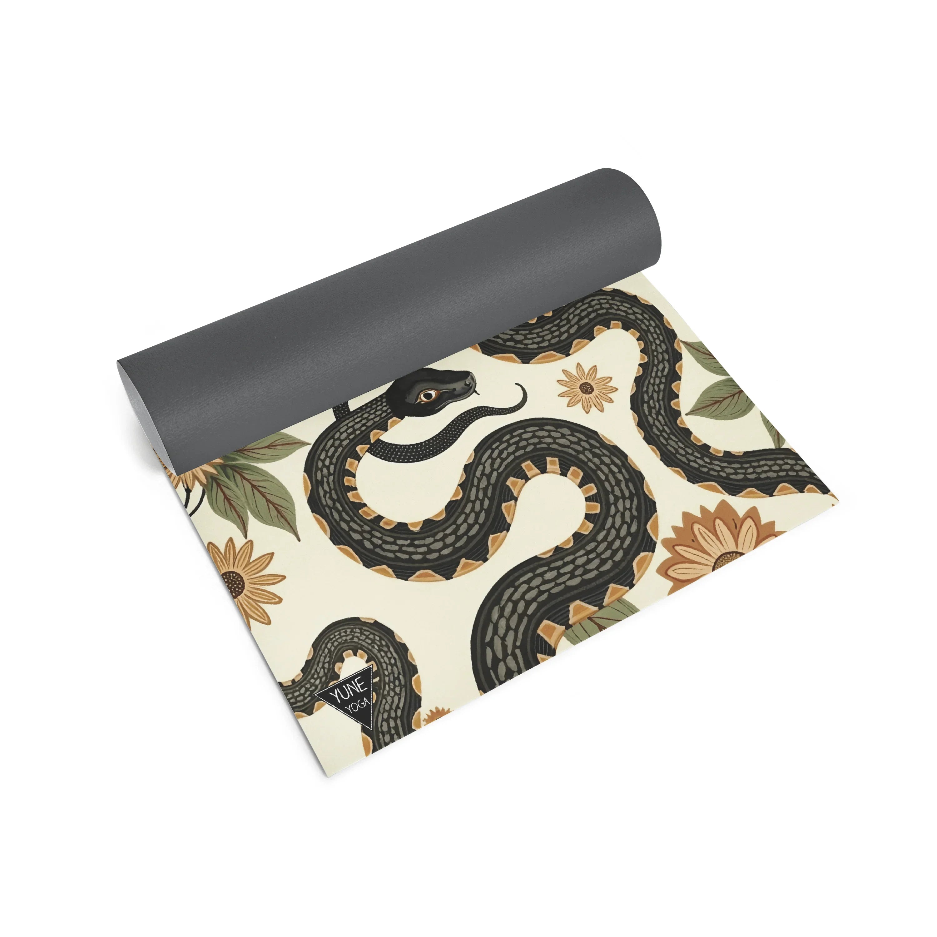 Yoga mat with snake and floral pattern on a white background