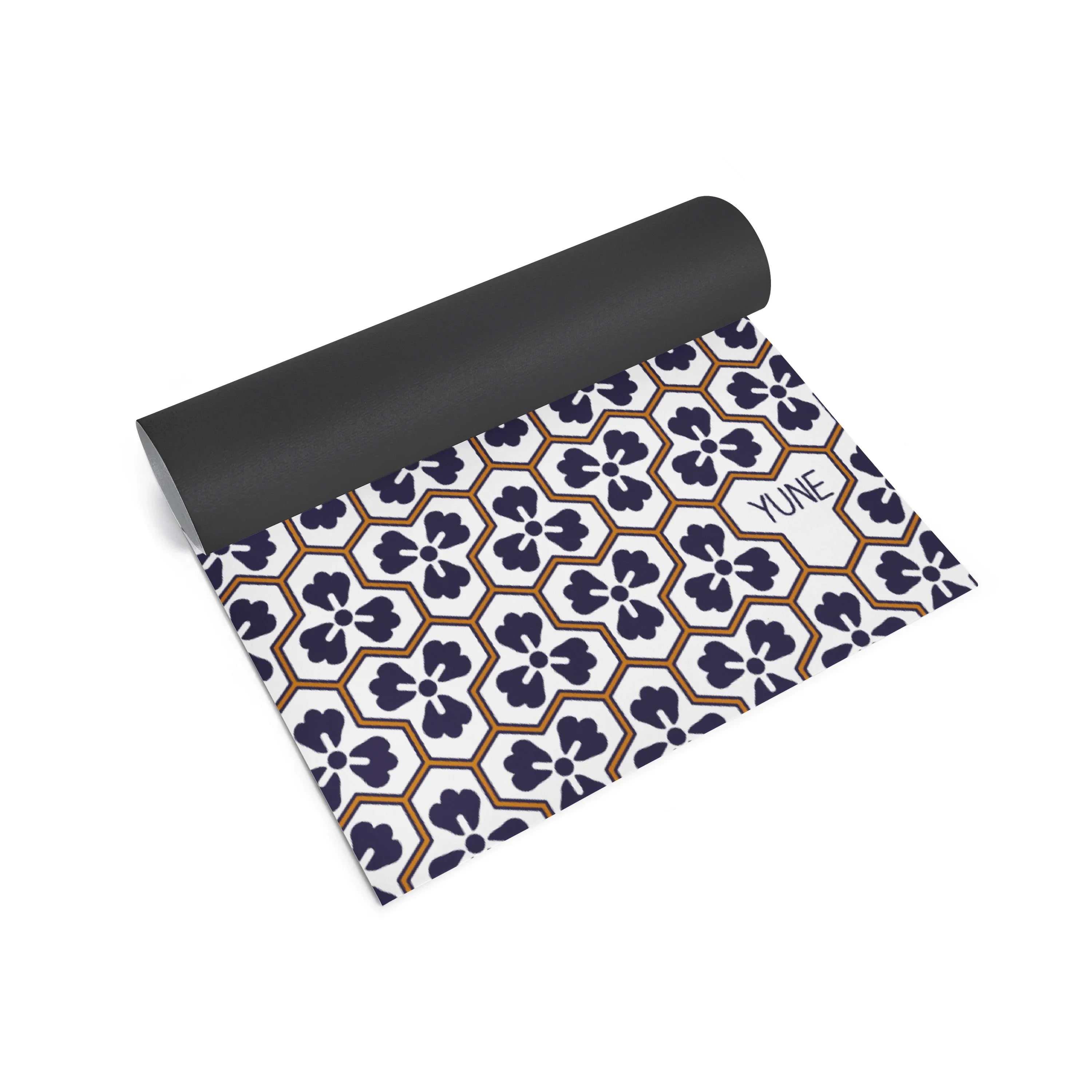 Yoga mat with geometric floral pattern and 'Yume' branding on a white background