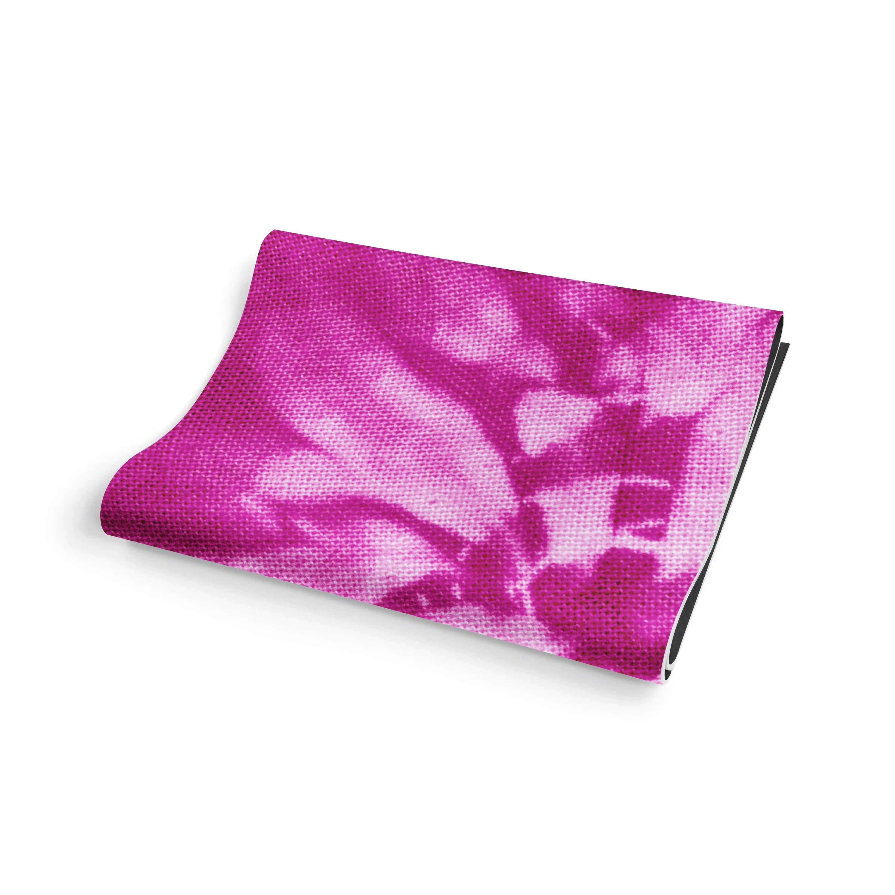 Folded pink fabric with a tie-dye pattern on a white background