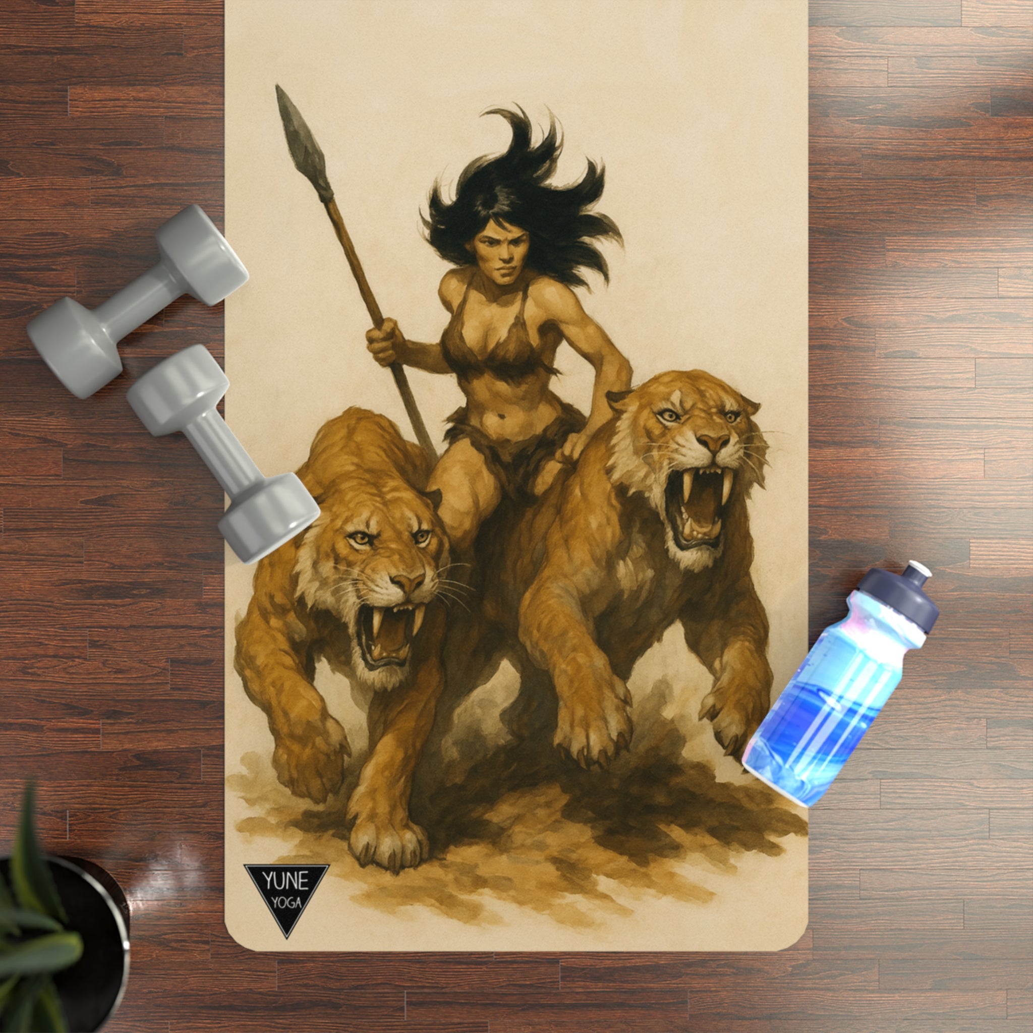 Yoga mat with warrior and lion design on a wooden floor with weights and water bottle.
