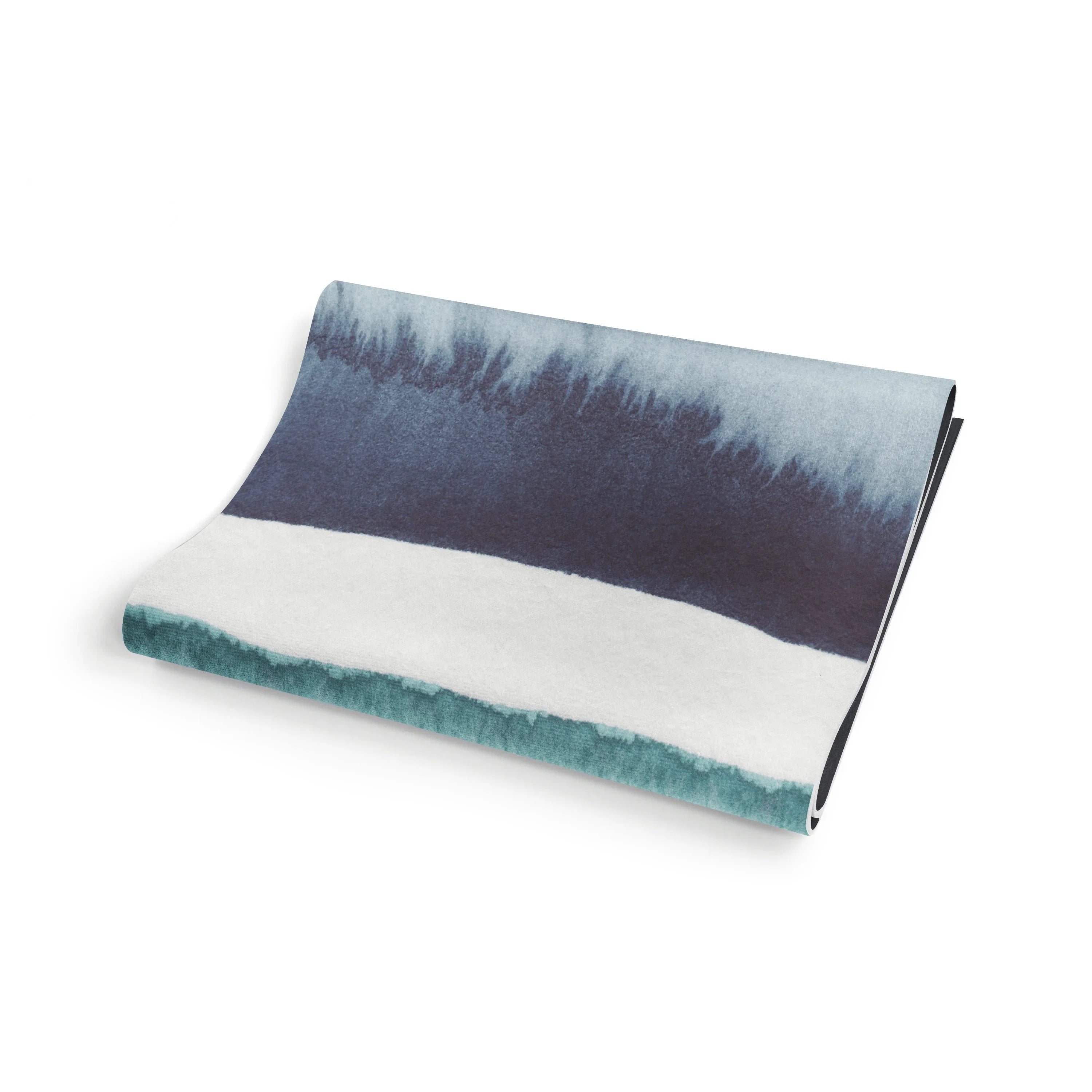 Folded fabric with gradient blue and white pattern on a white background