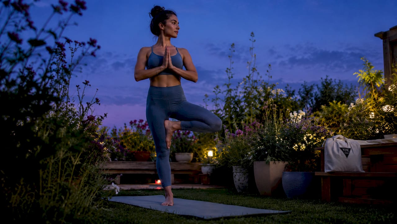 Woman doing eco-friendly yoga in sunlit room
