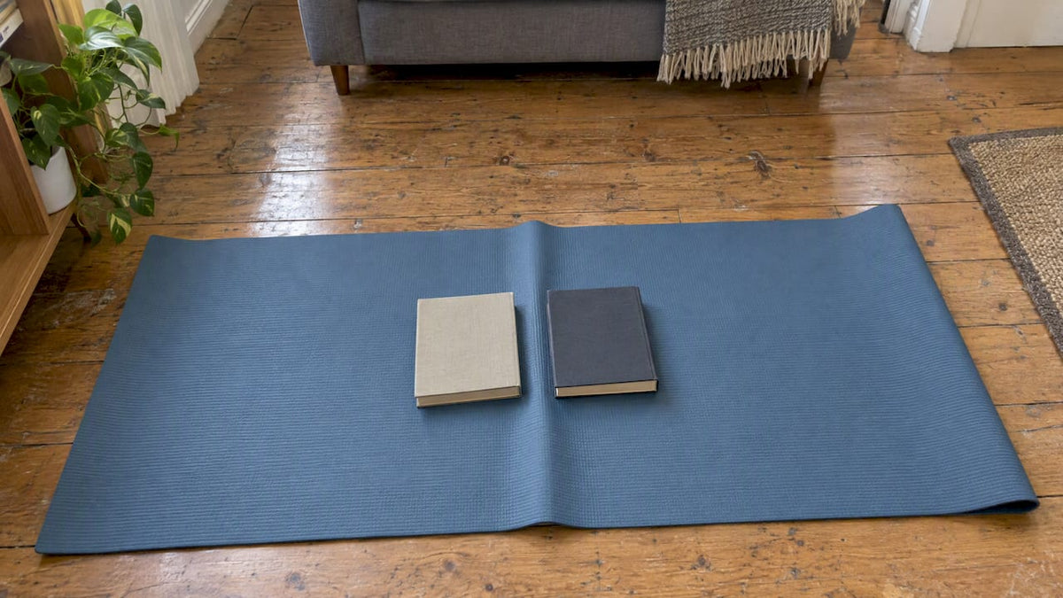Yoga mat crease held flat under books
