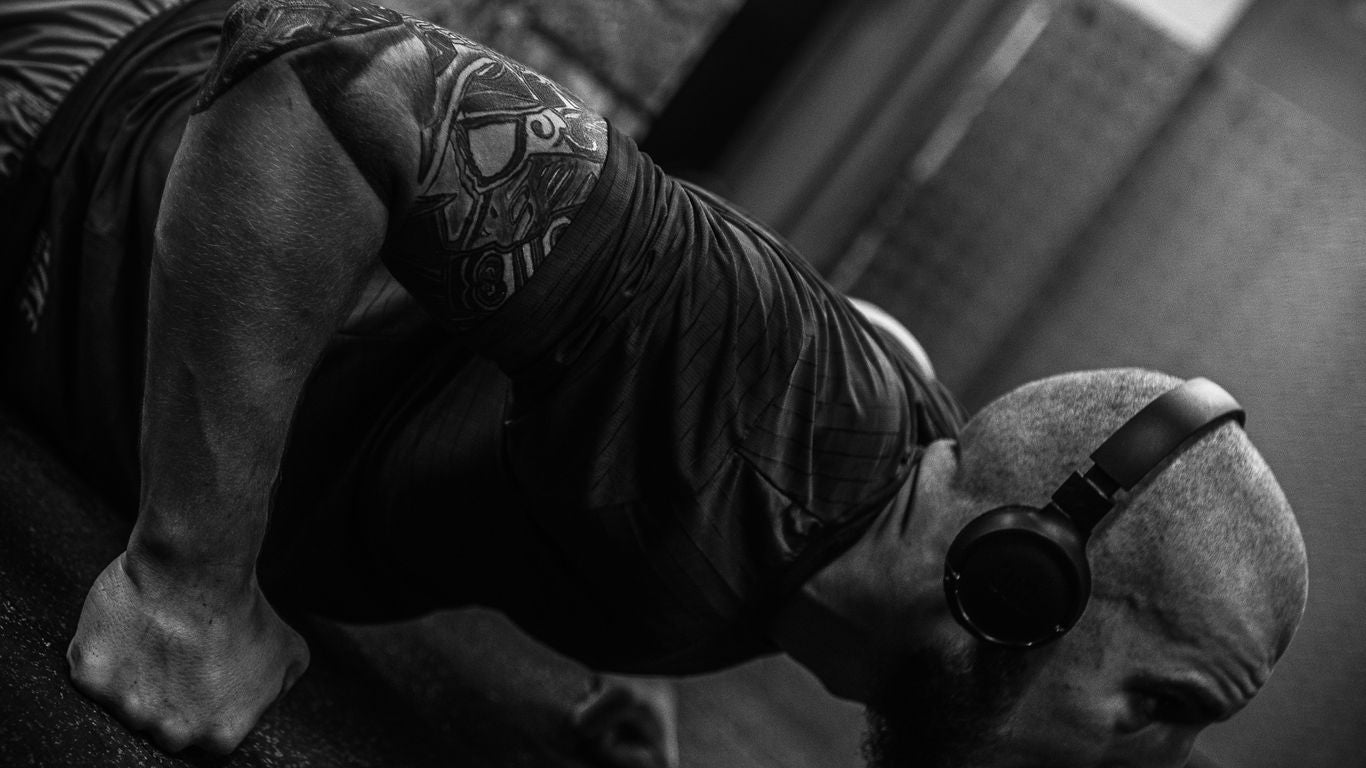 A man doing a handstand on a skateboard