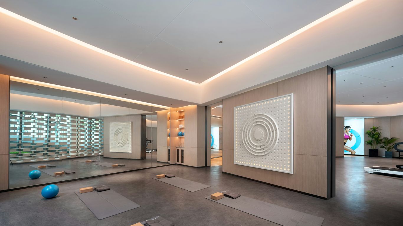 Modern yoga studio with mats and exercise balls.