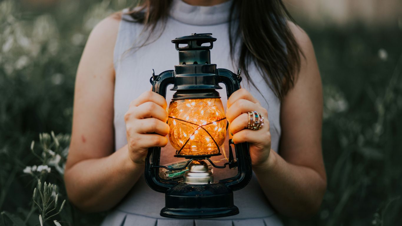 woman holding a lantern