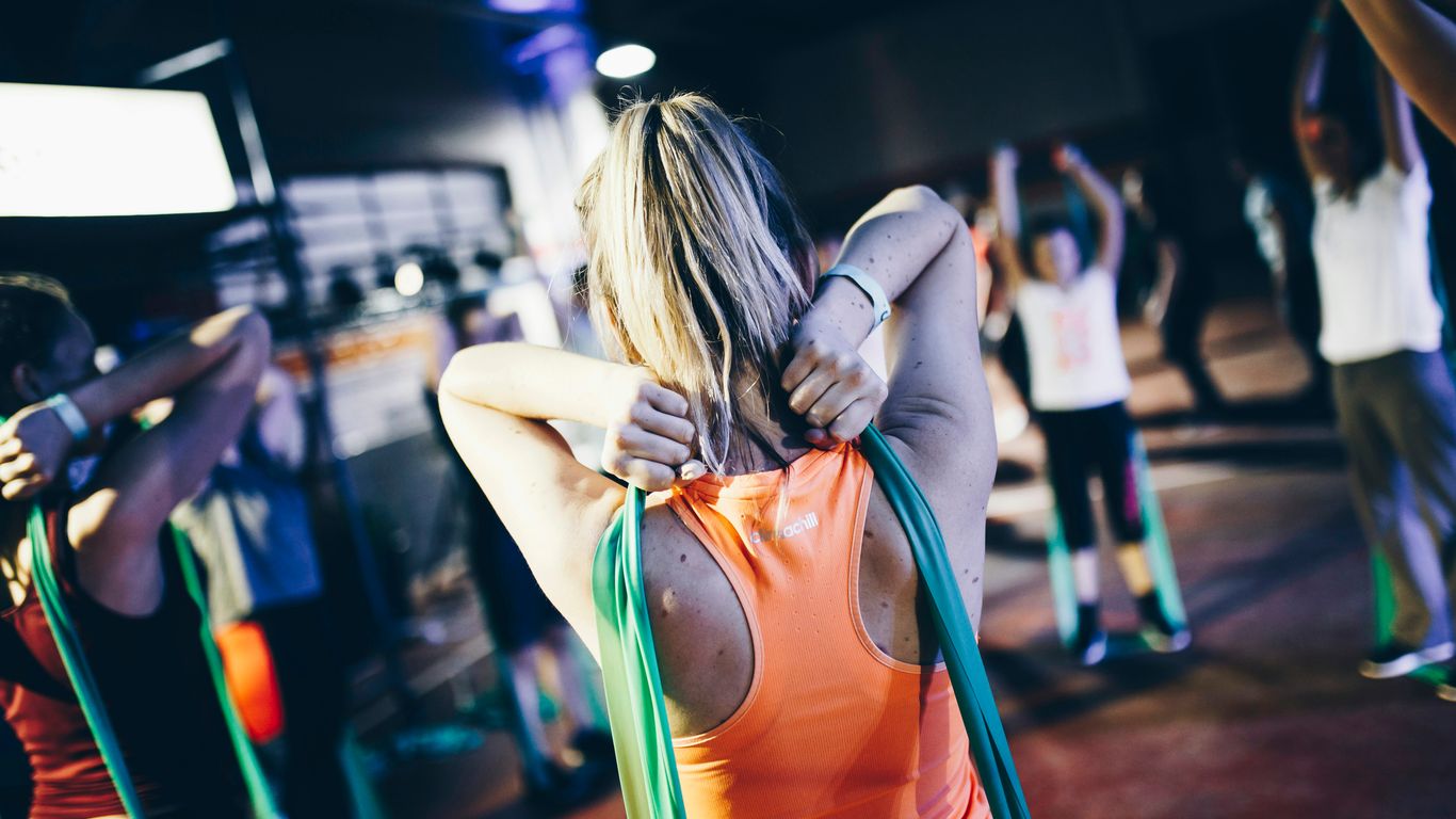 woman holding green rope at her back