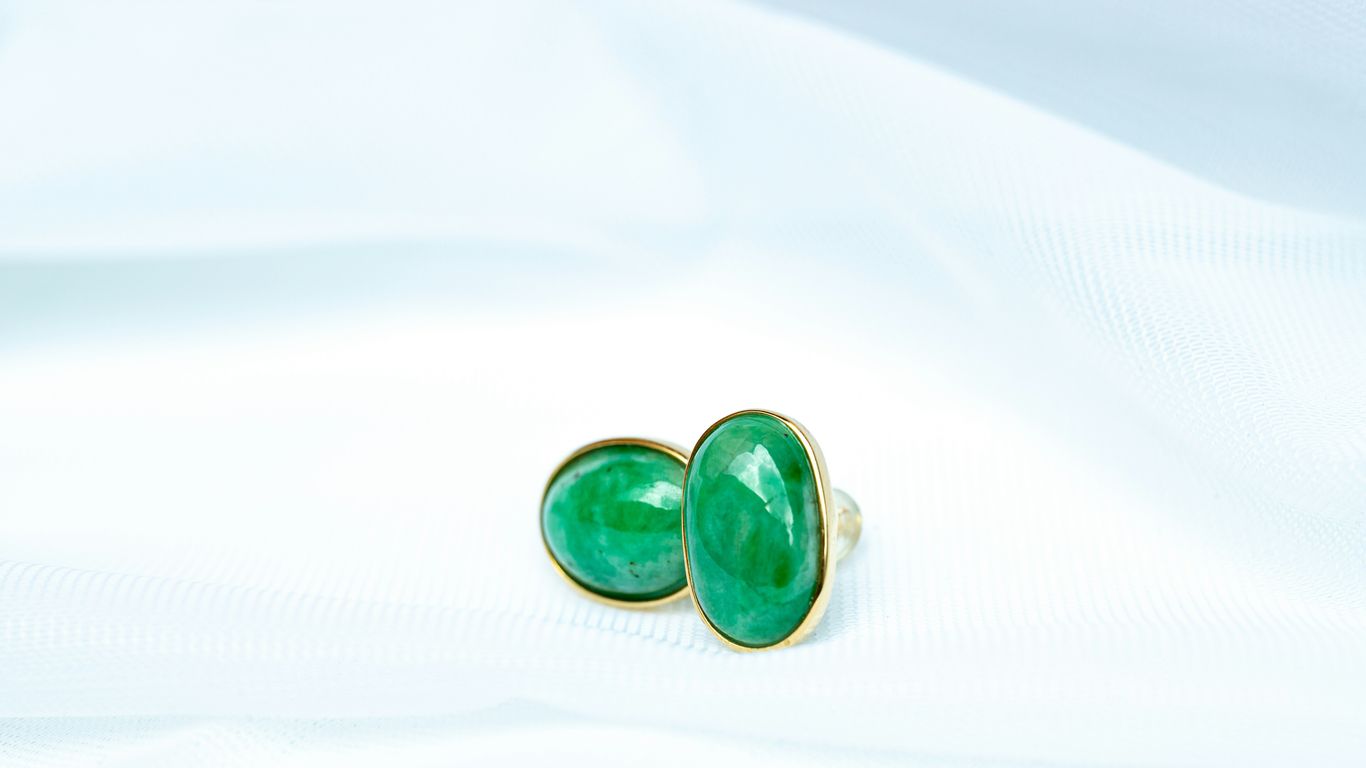 a pair of green and black dice