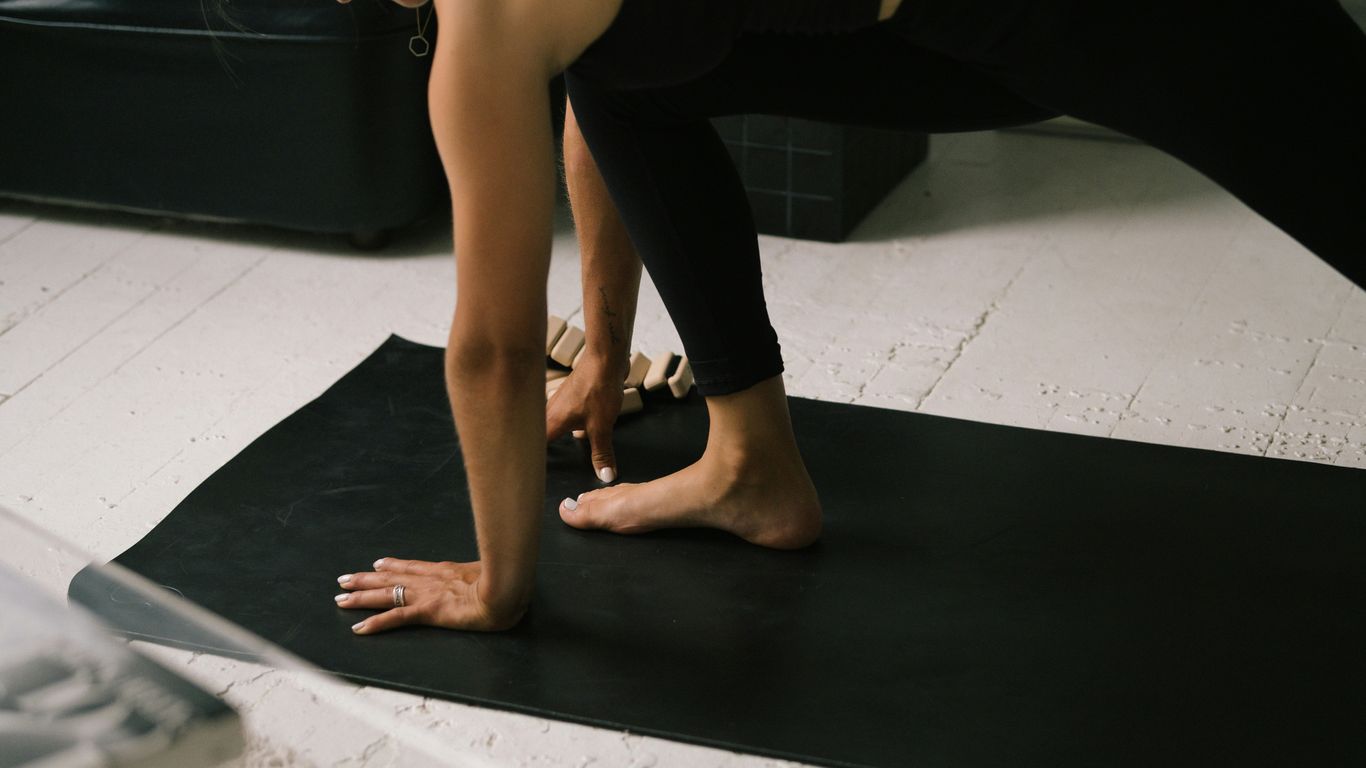 a pair of feet on a black surface
