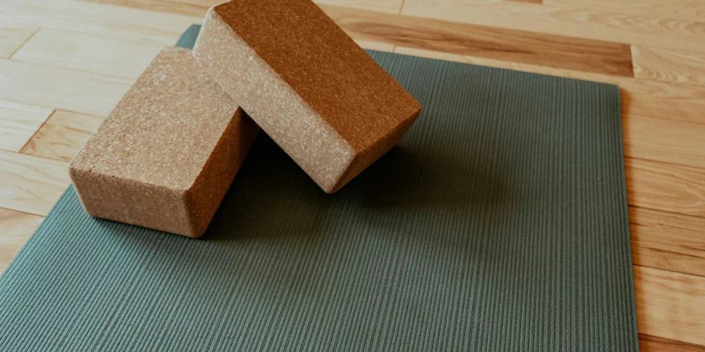 a yoga mat with two blocks on top of it