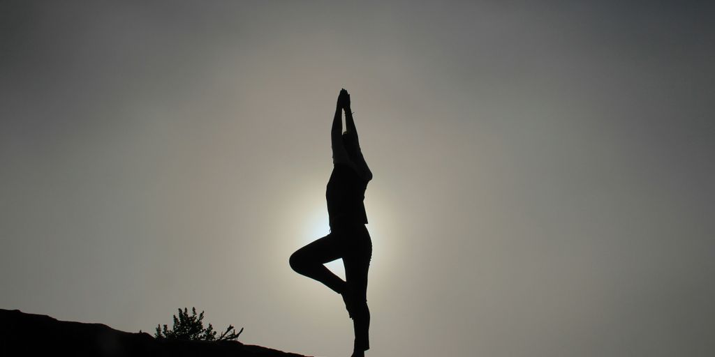 person doing yoga exercises