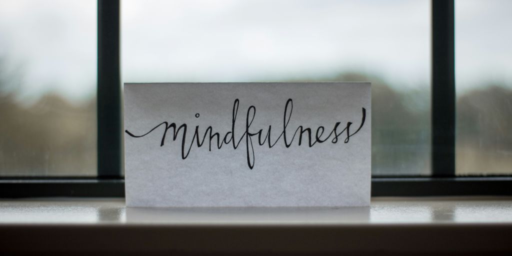 mindfulness printed paper near window