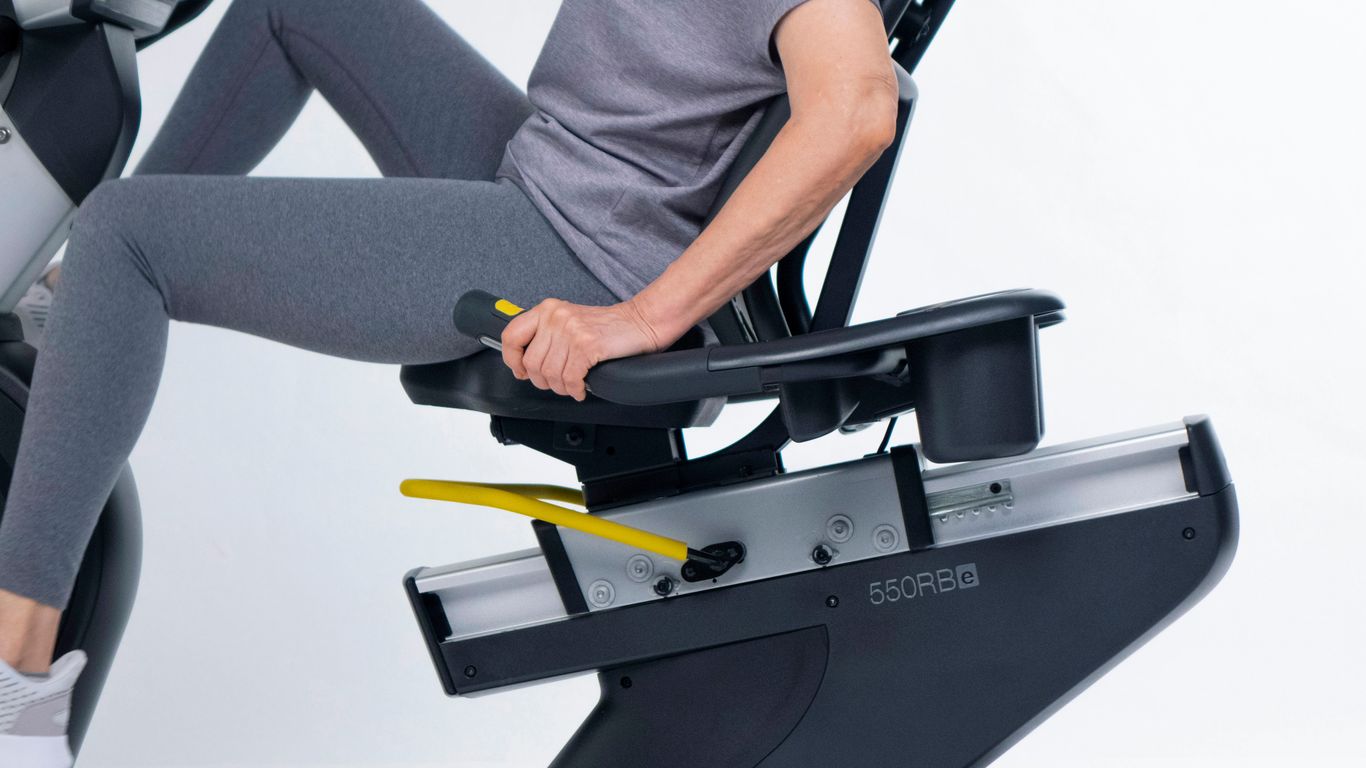 a man sitting on a stationary exercise bike