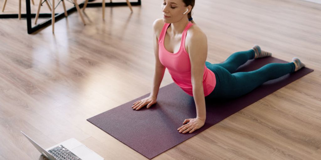 woman practicing yoga on a high-quality mat in a serene outdoor setting