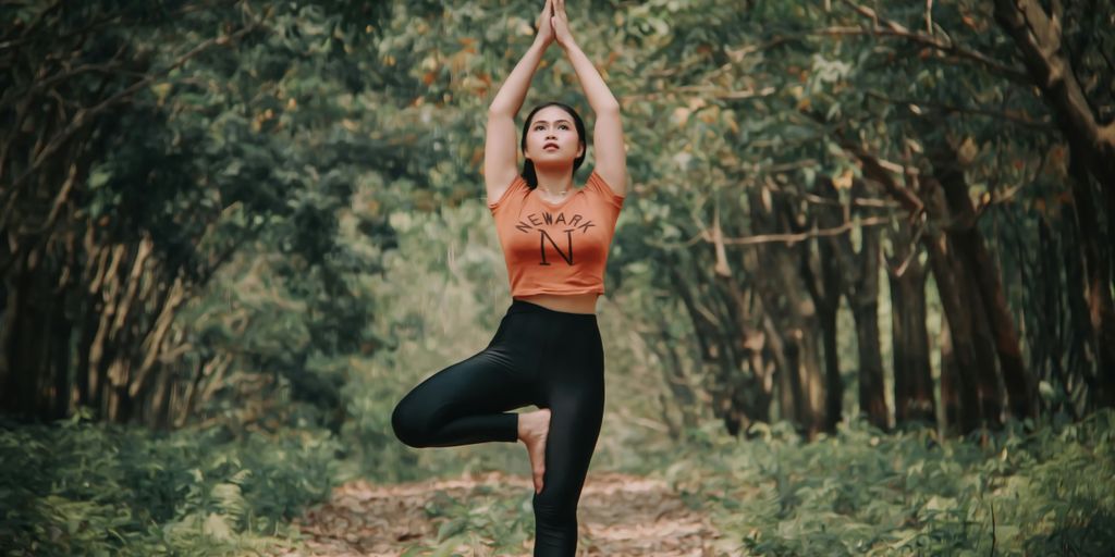 woman doing yoga near trees