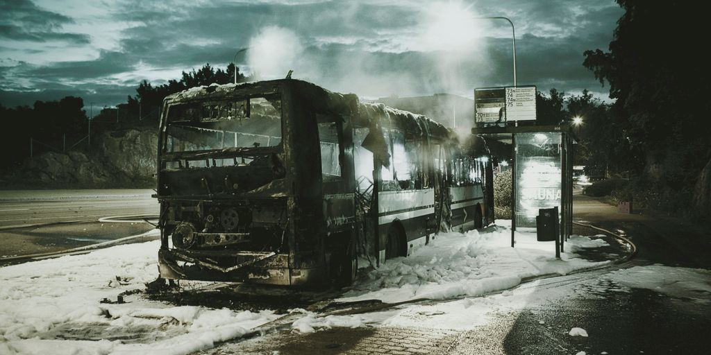 black bus near trees during daytime