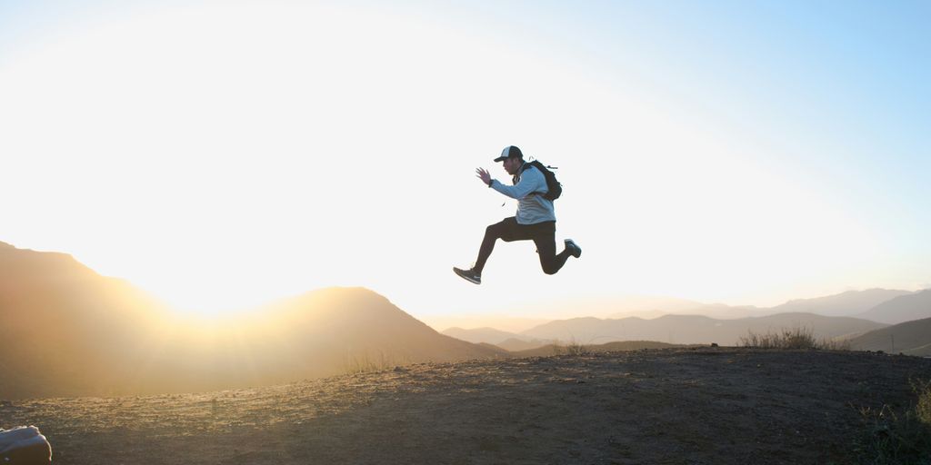 man wearing white long-sleeved shirt on air photo