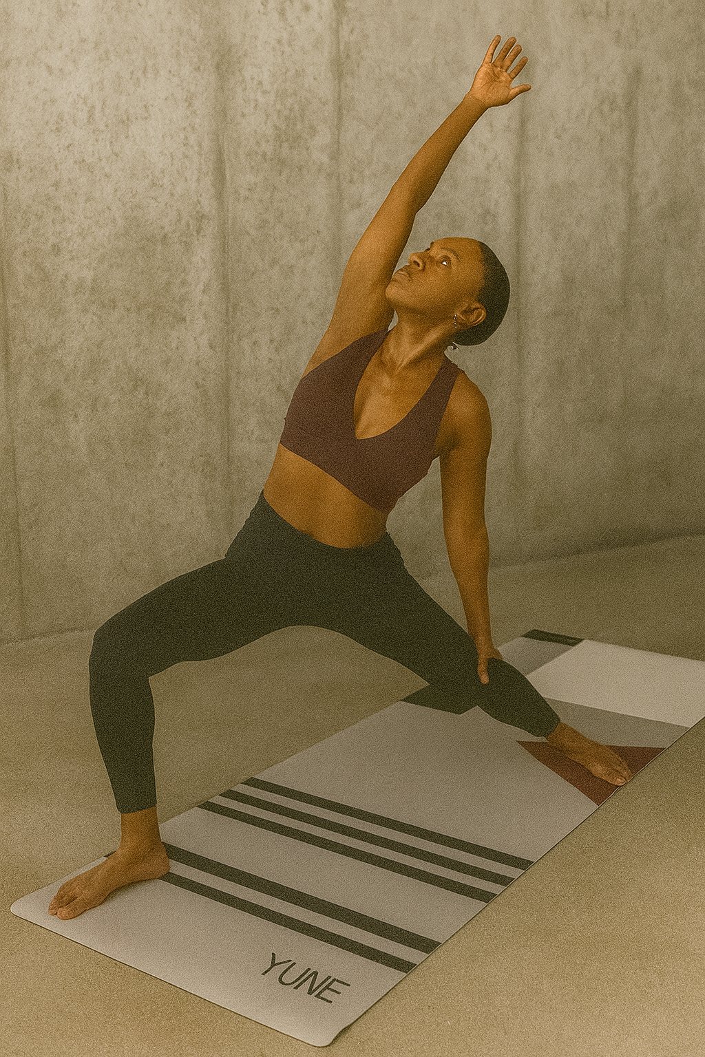 Person practicing yoga on a Yune mat with a neutral background