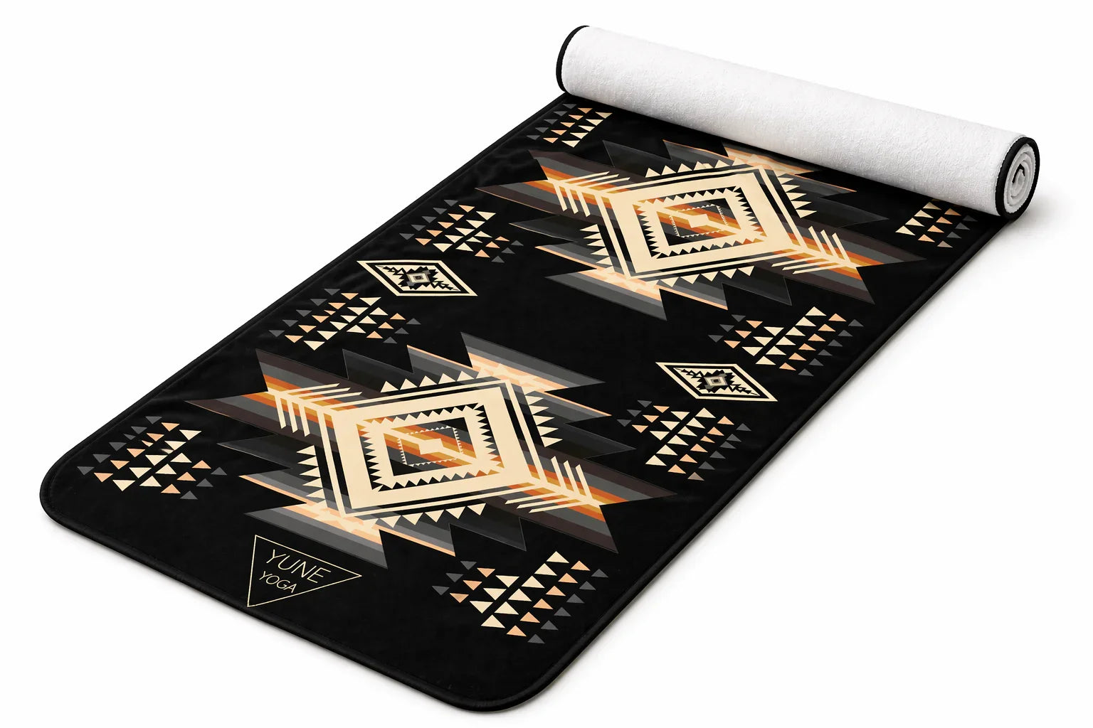 Black yoga mat with geometric tribal pattern in beige, orange, and gray tones