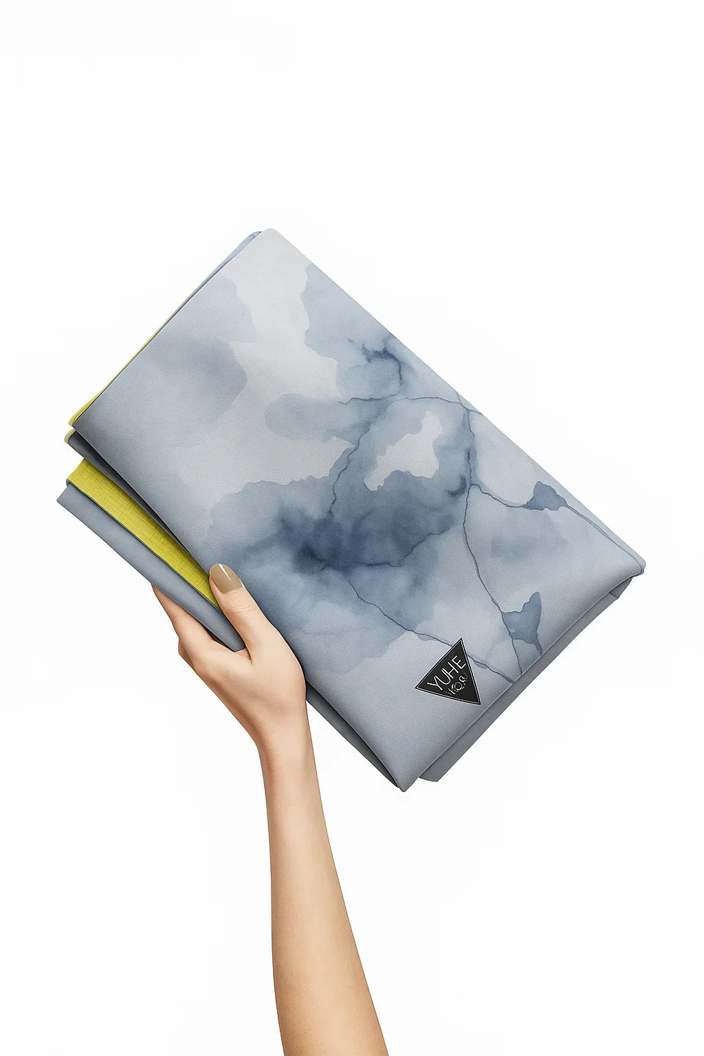 Hand holding a folded fabric with a blue and gray abstract pattern on a white background