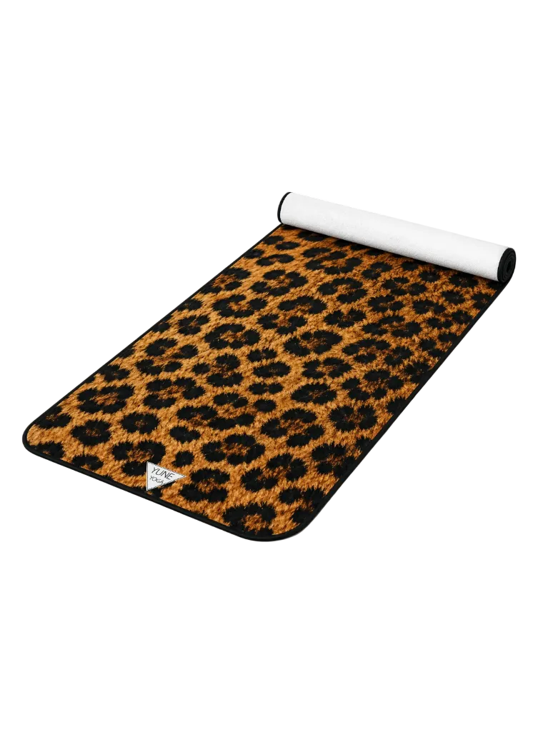 Leopard print yoga mat with rolled edge on white background, premium fitness accessory