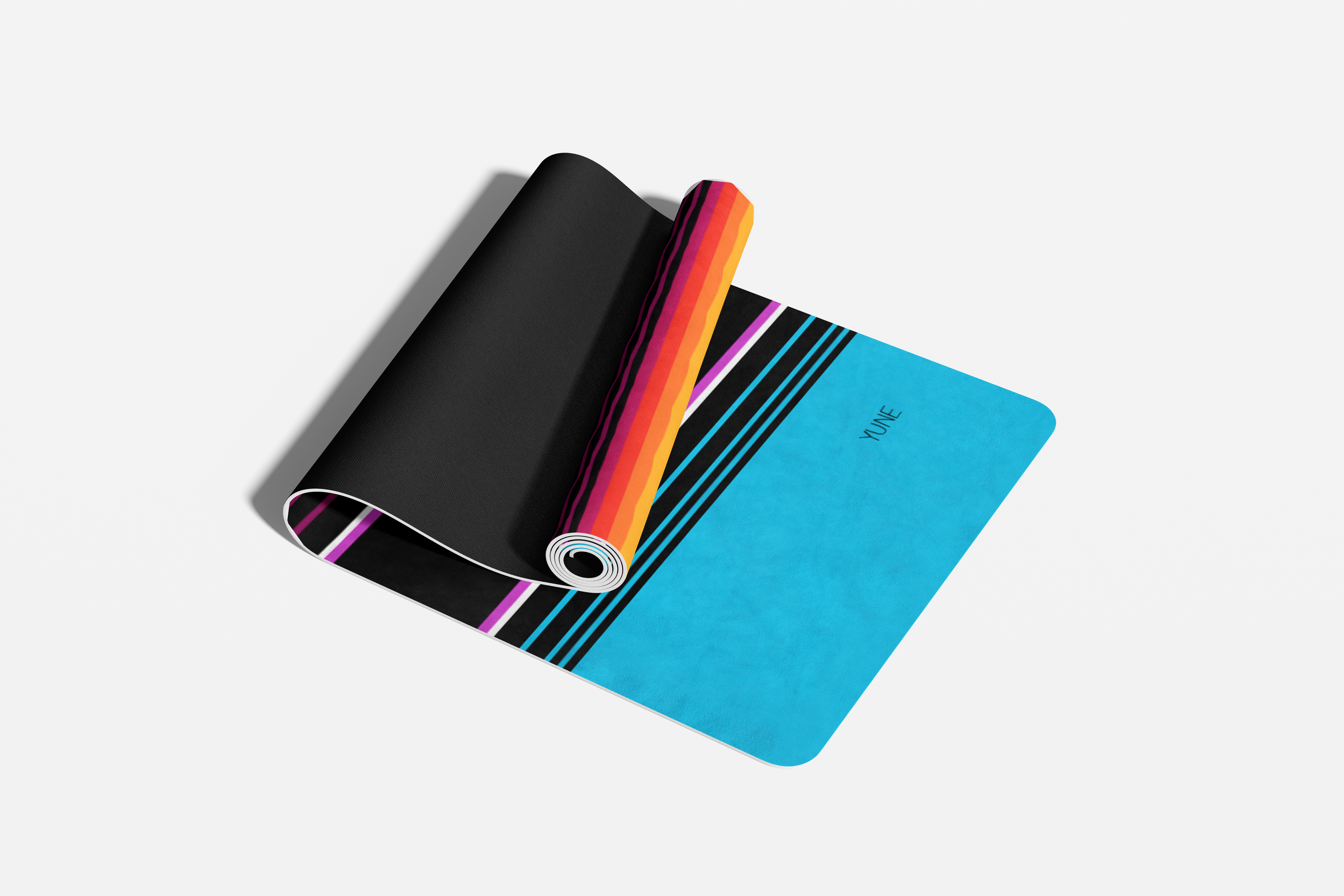 Colorful yoga mat with a carrying strap on a white background
