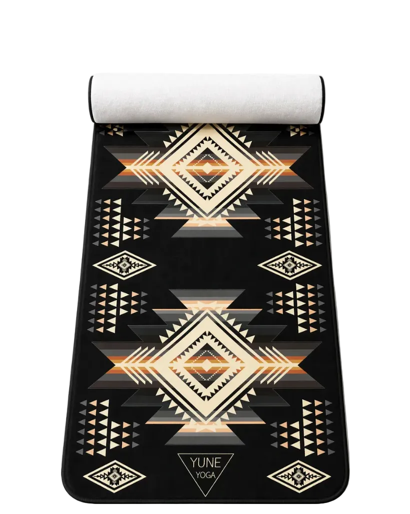 Southwestern pattern yoga towel mat with black, beige, and geometric tribal designs